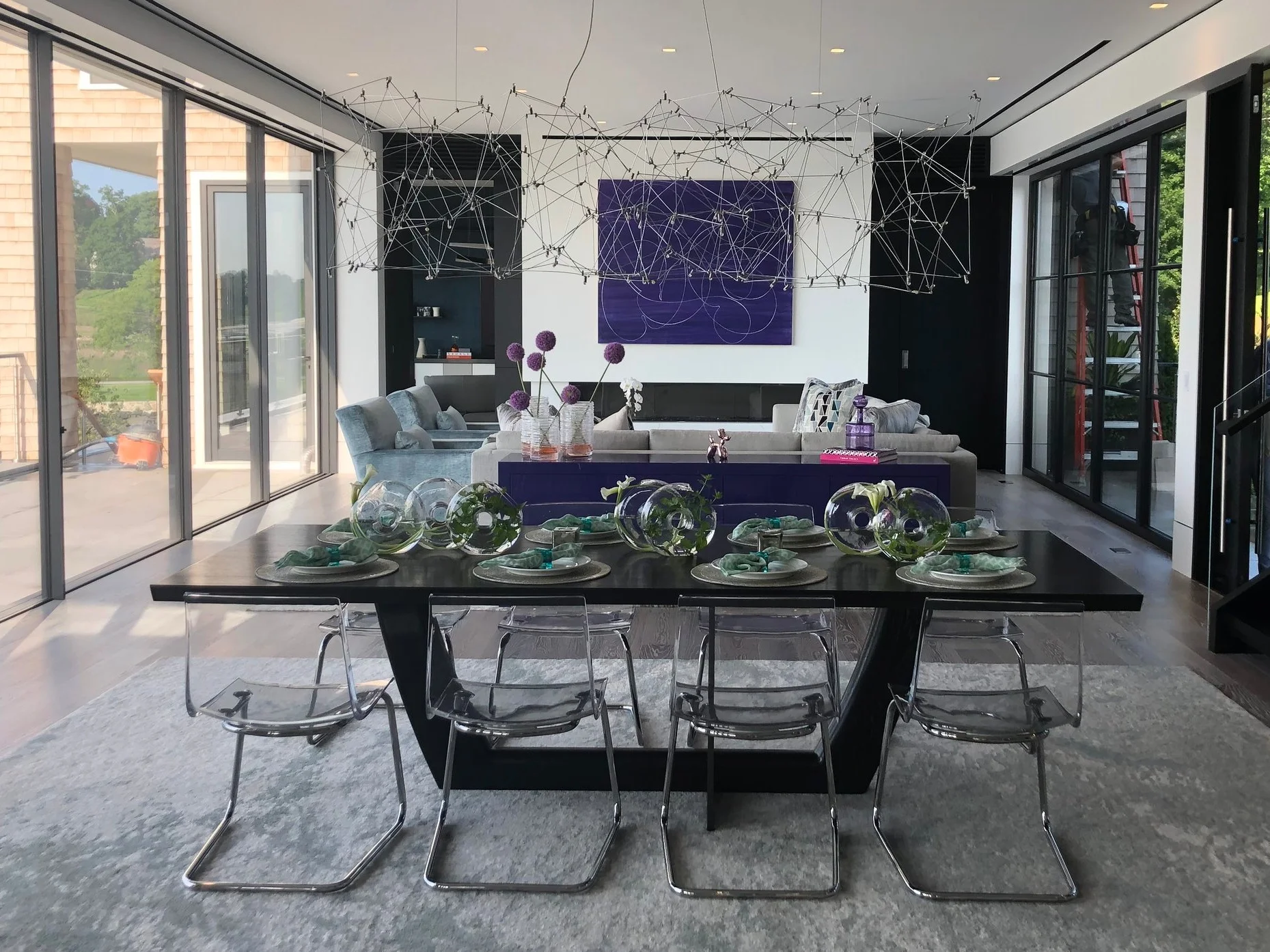 Ebonized white oak dining table with blackened steel support.