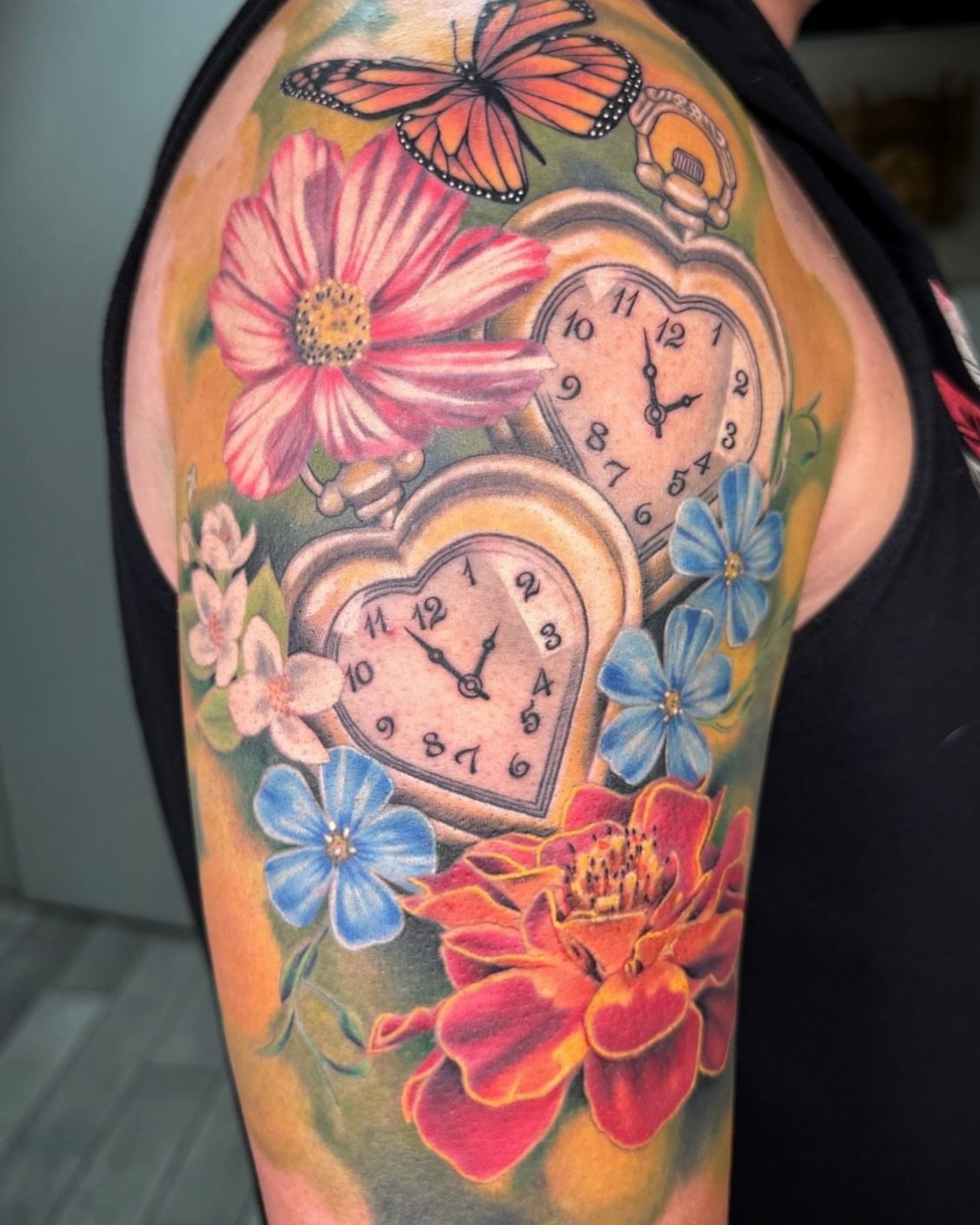 🌹🌸Completed half sleeve done by @neri_ramirez a few final touchups completed this #colorful flower, and timeclock piece! To schedule an appointment with Neri you can have over to his website at neriramirez.com #adornmentbodyart #adornmentstudios #a