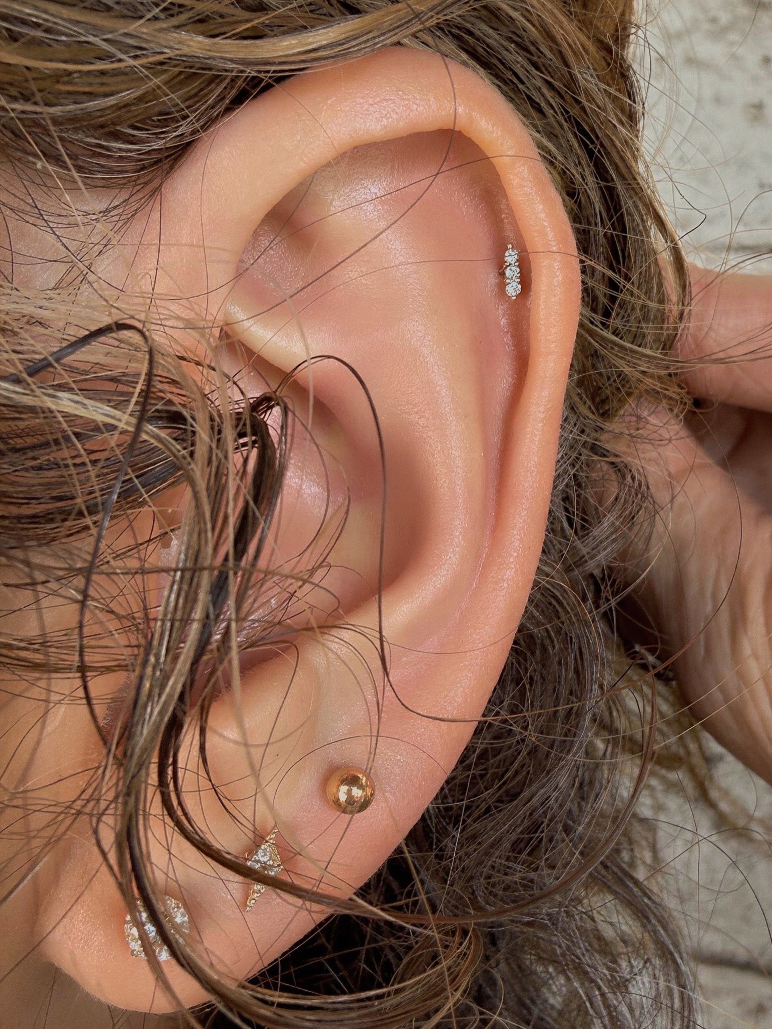 Helix piercing with the &lsquo;mishka&rsquo; from Buddha Jewelry. And the prettiest London Blue Topaz stones. Piercing performed by @savvypiercings