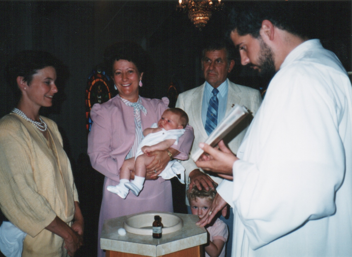 My brother Alex being baptized while my oldest brother Dillon looks cute and my mom (yellow) looks perfect. 