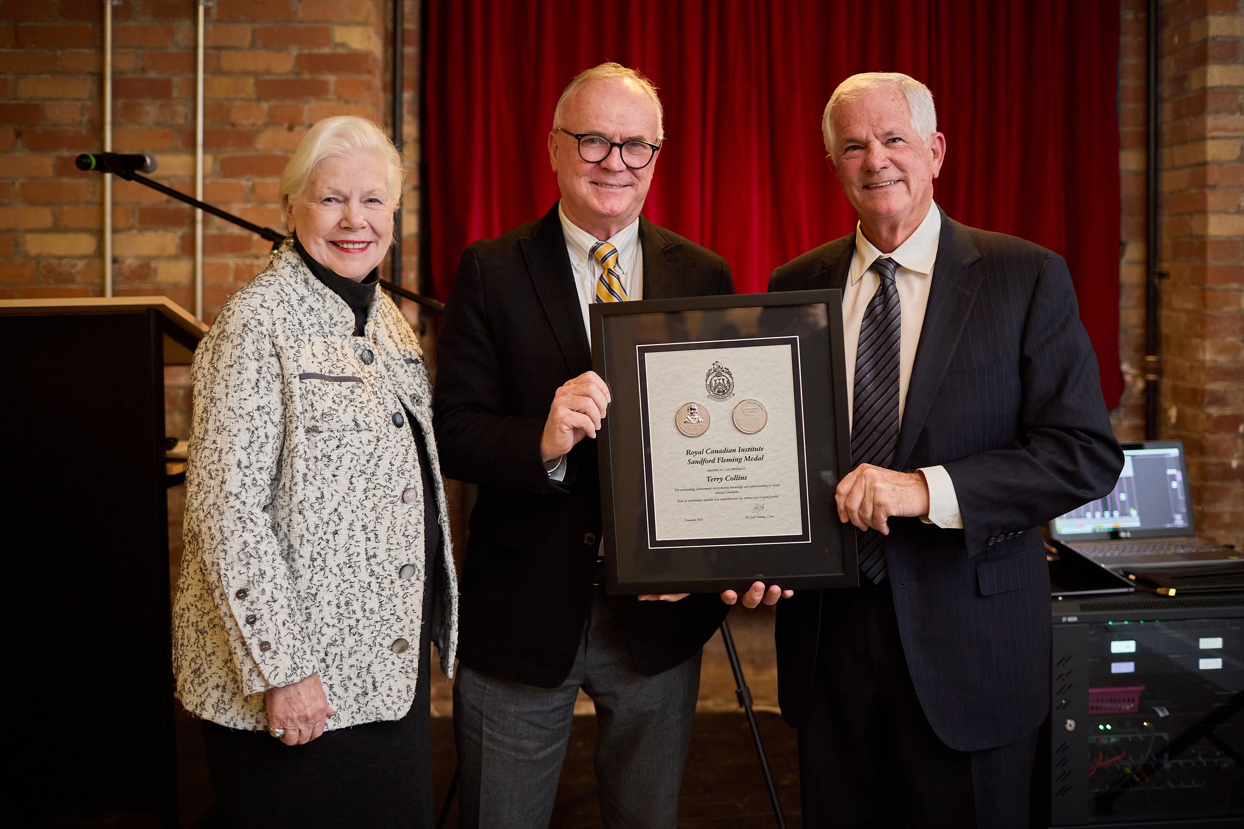  Science writer Terry Collins receives the 2023 Sandford Fleming Medal from Jock Fleming (descendent of RCIScience founder Sir Sandford Fleming for whom the award is named) and The Honourable Elizabeth Dowdeswell, OC OOnt, the 29th Lieutenant Governo