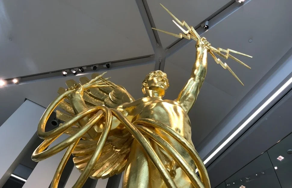 The Golden Boy has stood in downtown Dallas since 2009. It is currently removed from the lobby and will return to the campus in late 2019.