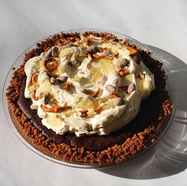 From the archives: junk food pie. Chocolate fudge pie, with a graham cracker crust, topped with peanut butter whipped cream, garnished with pretzels, potato chips, and peanuts given the &ldquo;muddy buddy&rdquo; treatment. Photos: @fayetobin . Specia