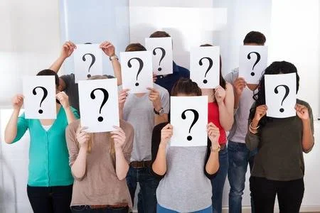 27052892-group-multiethnic-university-students-holding-question-mark-signs-in-front-of-their-faces.jpg