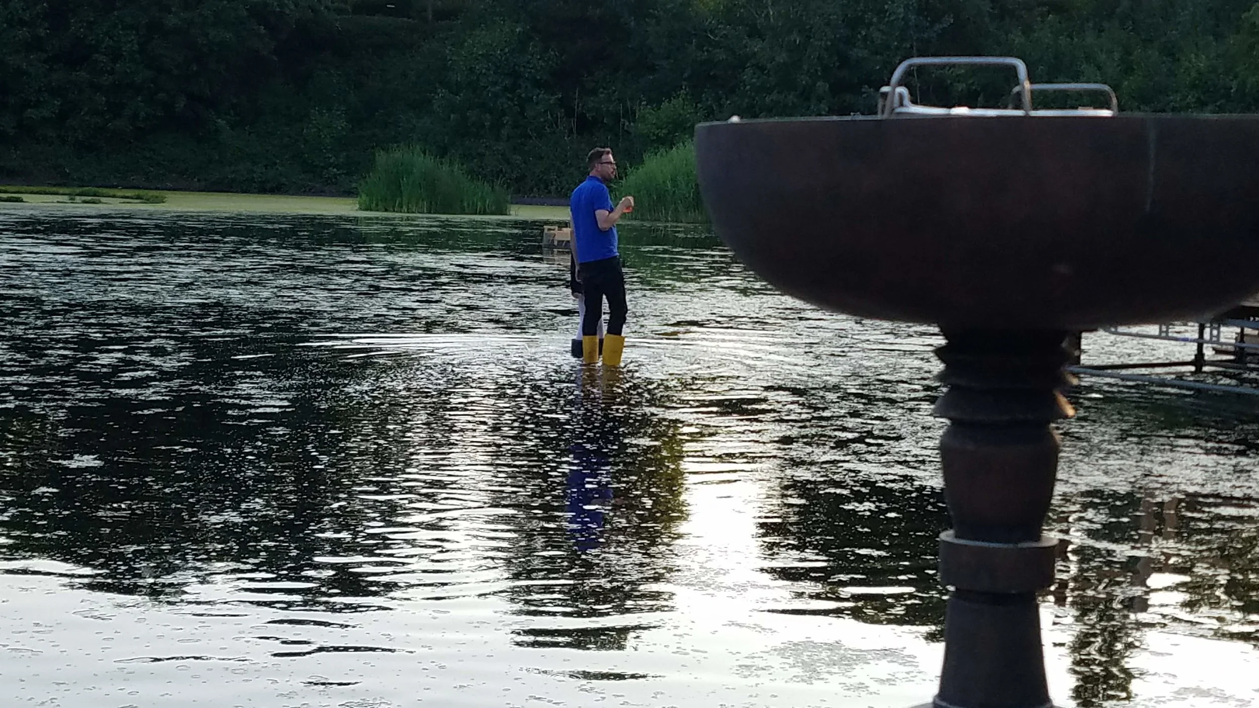 Markus Bader, out for a walk. The water around the Floating University is very shallow - after some rain, maybe six inches. Whenever it is time to have a conversation, you can simply pull on a pair of fishing boots, and start doing laps around the reservoir.