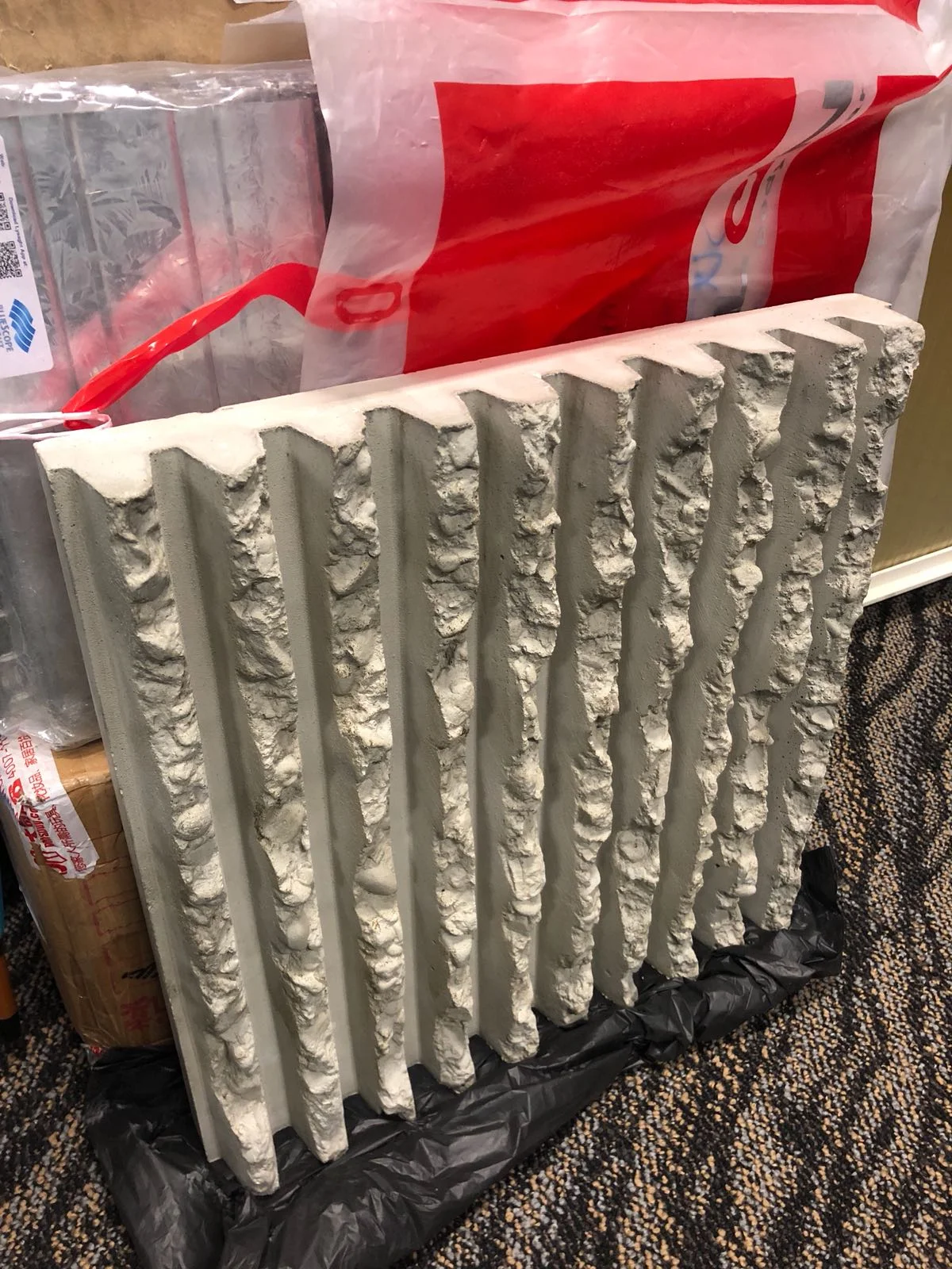 JOHN WAN will wrap a 4-story electrical substation in Singapore with corduroy, only instead of hand chiseled with hammers, done with a rubber mold.