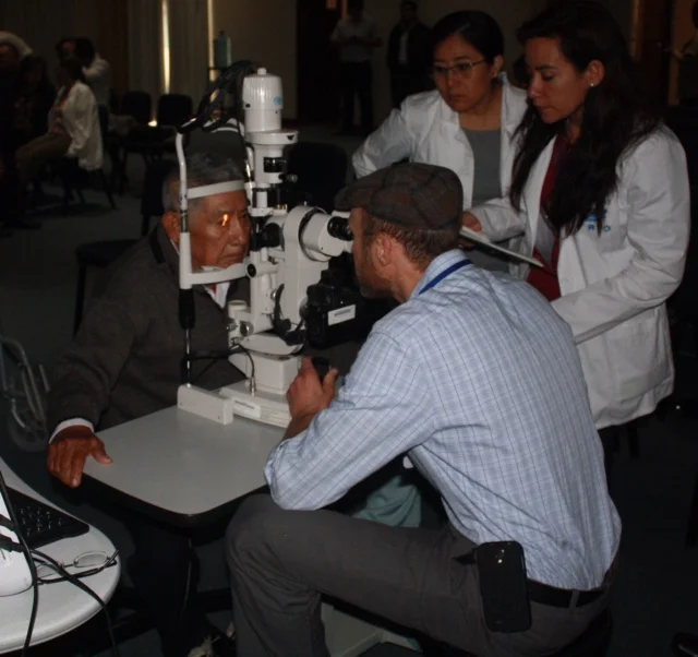 Dr. Kresch at the slit lamp in Trujillo, Peru