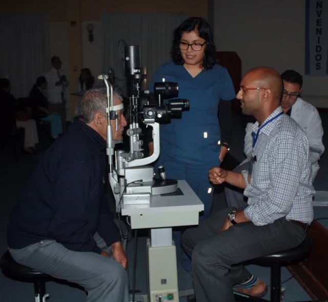 Dr. Shah at the slit lamp in Trujillo, Peru