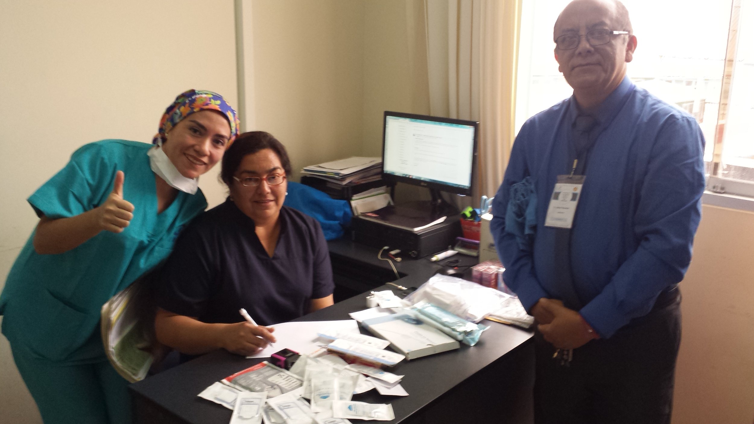 Dr. Lisseth Namoc and Dr. Jaime Huaman accepting the World Eye Mission donated supplies for performing complex cataract surgery. Some of these products had never been used at IRO before