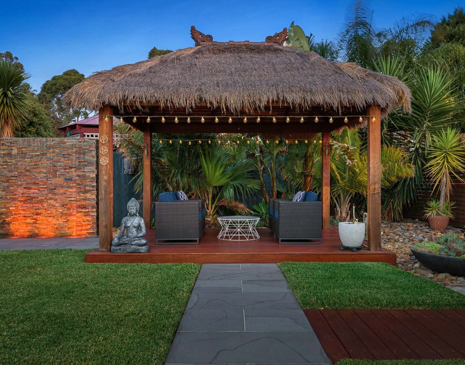  Bali Hut at twilight surrounded by beautiful gardens and the perfect place to relax.   