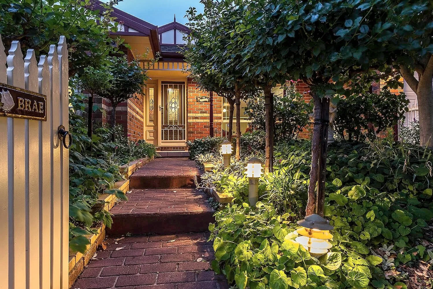  Naismith House - Beautiful garden providing a cottage style feel to this character home at twilight  