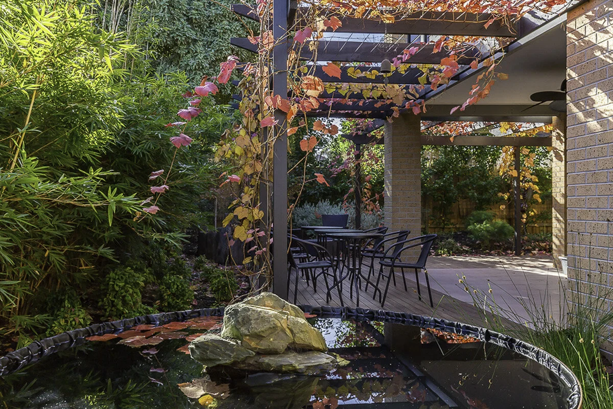  Lowen House - Stunning autumn colours create a peaceful backdrop to the fishpond in the foreground 