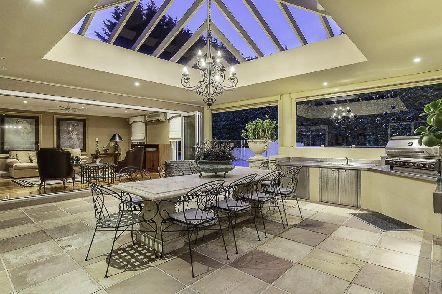  Tirhatuan Dr House - Expansive covered entertainment area with sandstone paving, glass skylight and luxury built-in outside kitchen with barbeque. The perfect place to entertain. 