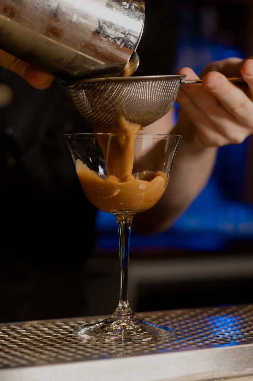 Cocktail strained into glass