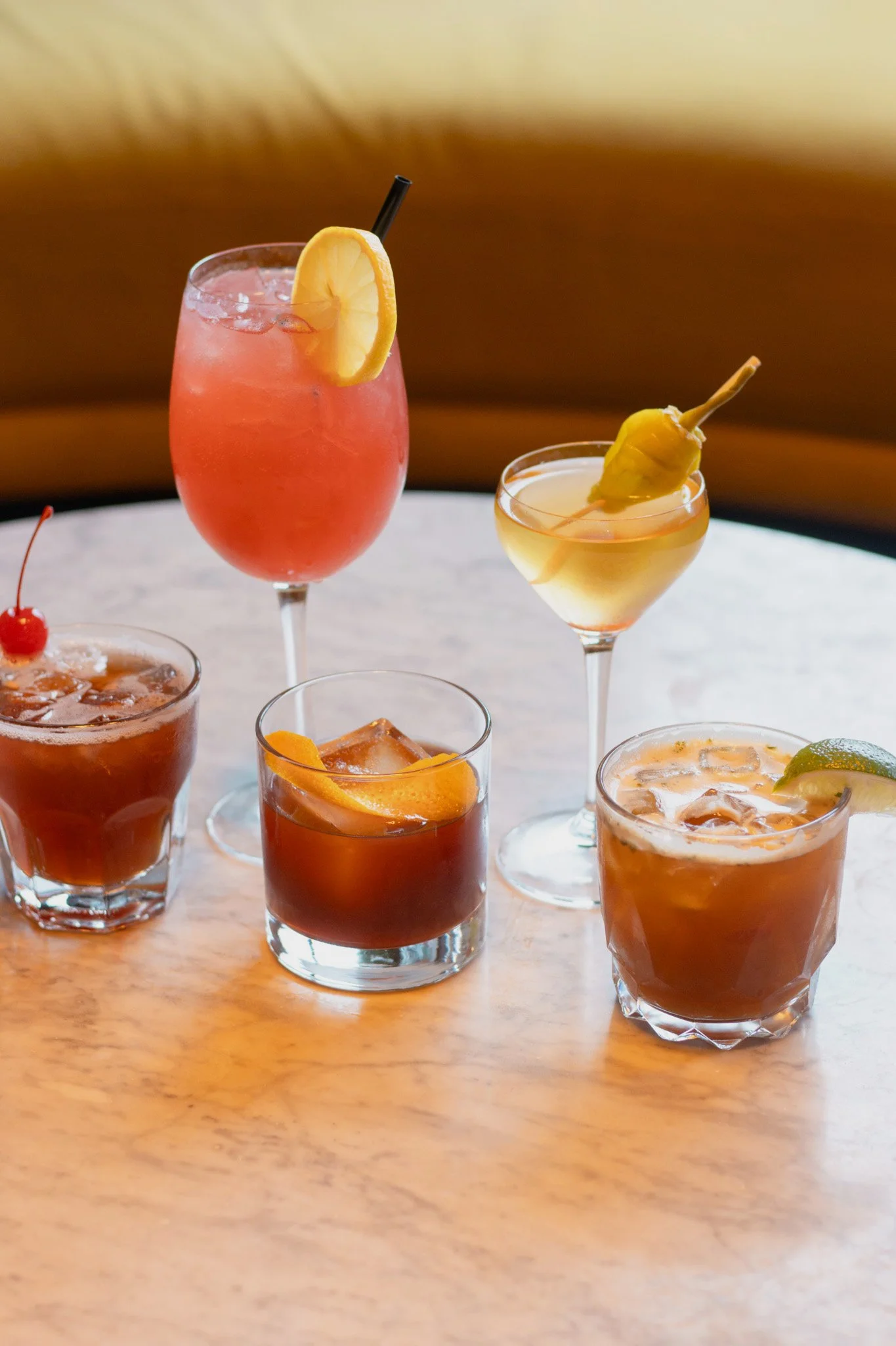 Collection of Charlotte's cocktails on a marble table