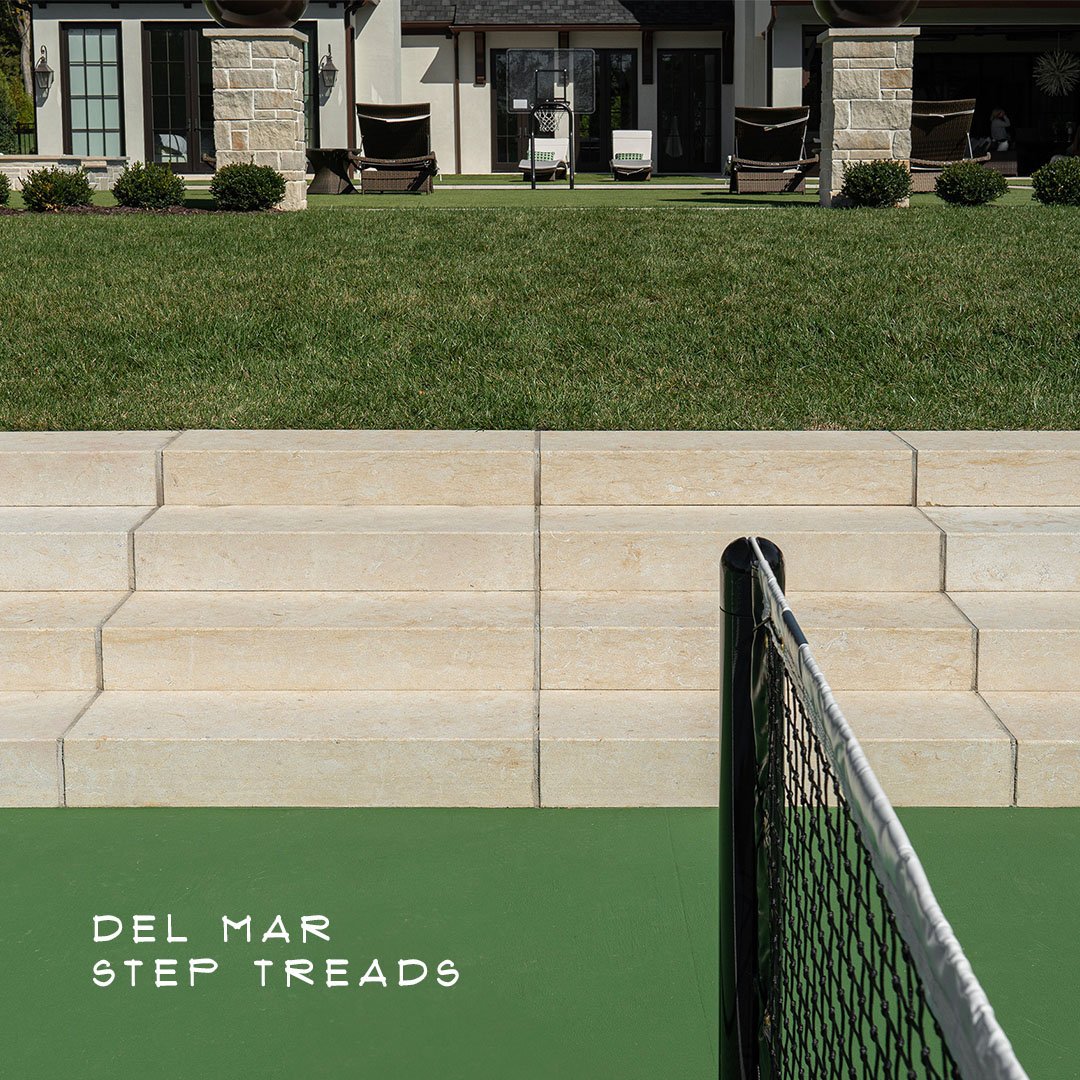 Cohesive material selections can unify different spaces throughout your project and create an elevated look. This home features our exclusive Del Mar limestone across it&rsquo;s paving and pool coping, and continues with these custom cut Del Mar step