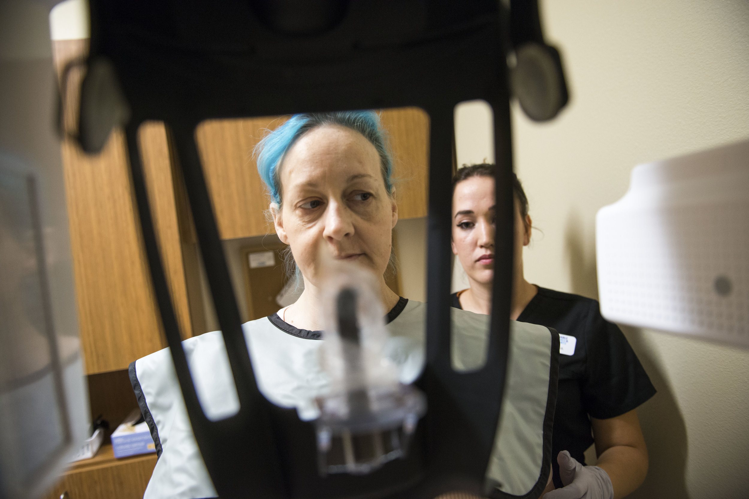  Timberly Eyssen, left, prepares for Dental Assistant Sam Mattix to take an X-ray of her teeth at Affordable Dentures in Vancouver, Wash., on Friday morning, July 13, 2018. A skydiving accident in 2011 left Eyssen with a broken neck, which eventually