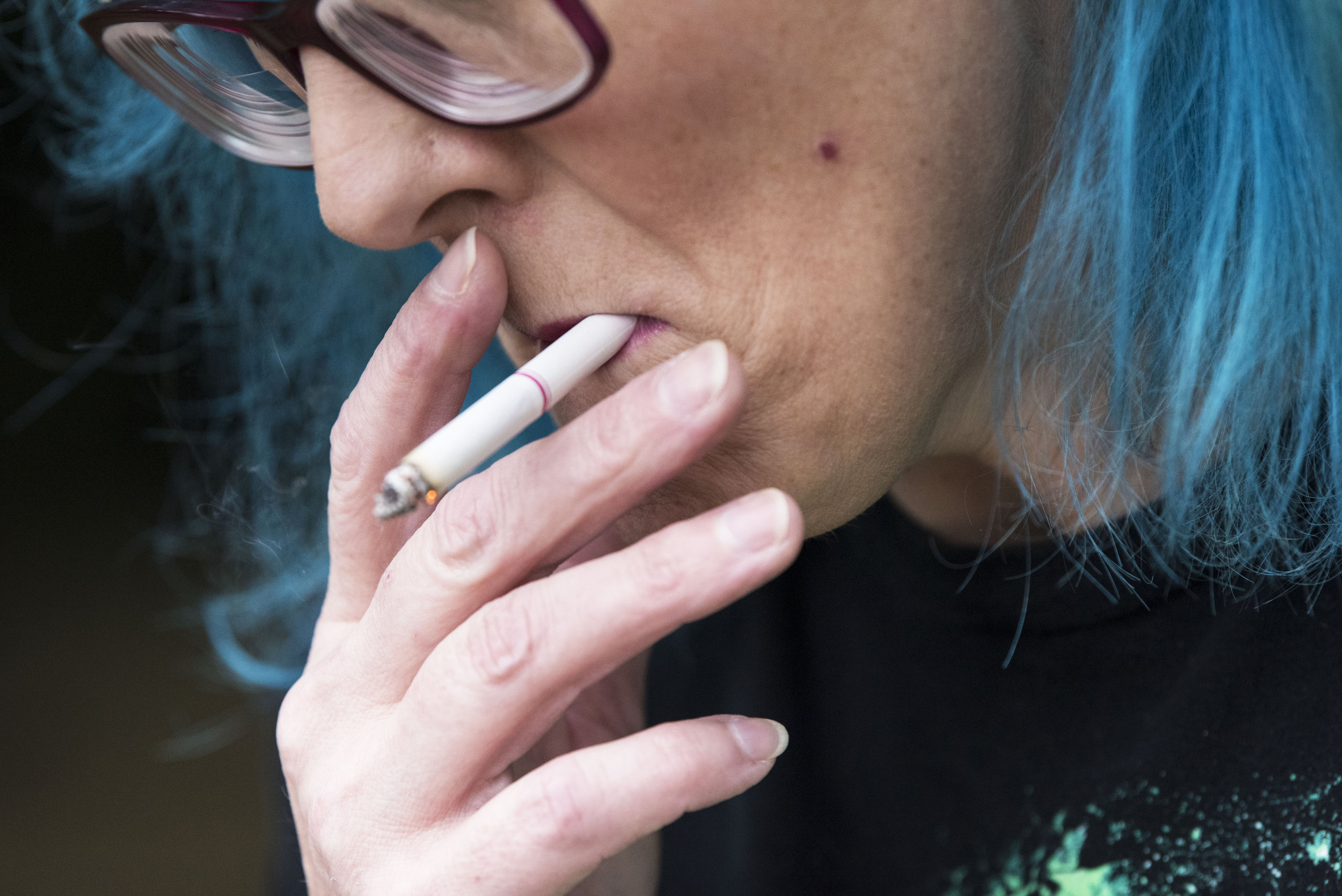  Timberly Eyssen smokes a cigarette, which she calls her "last remaining addiction," between therapy appointments at Columbia River Mental Health Services on Monday, July 9, 2018. 