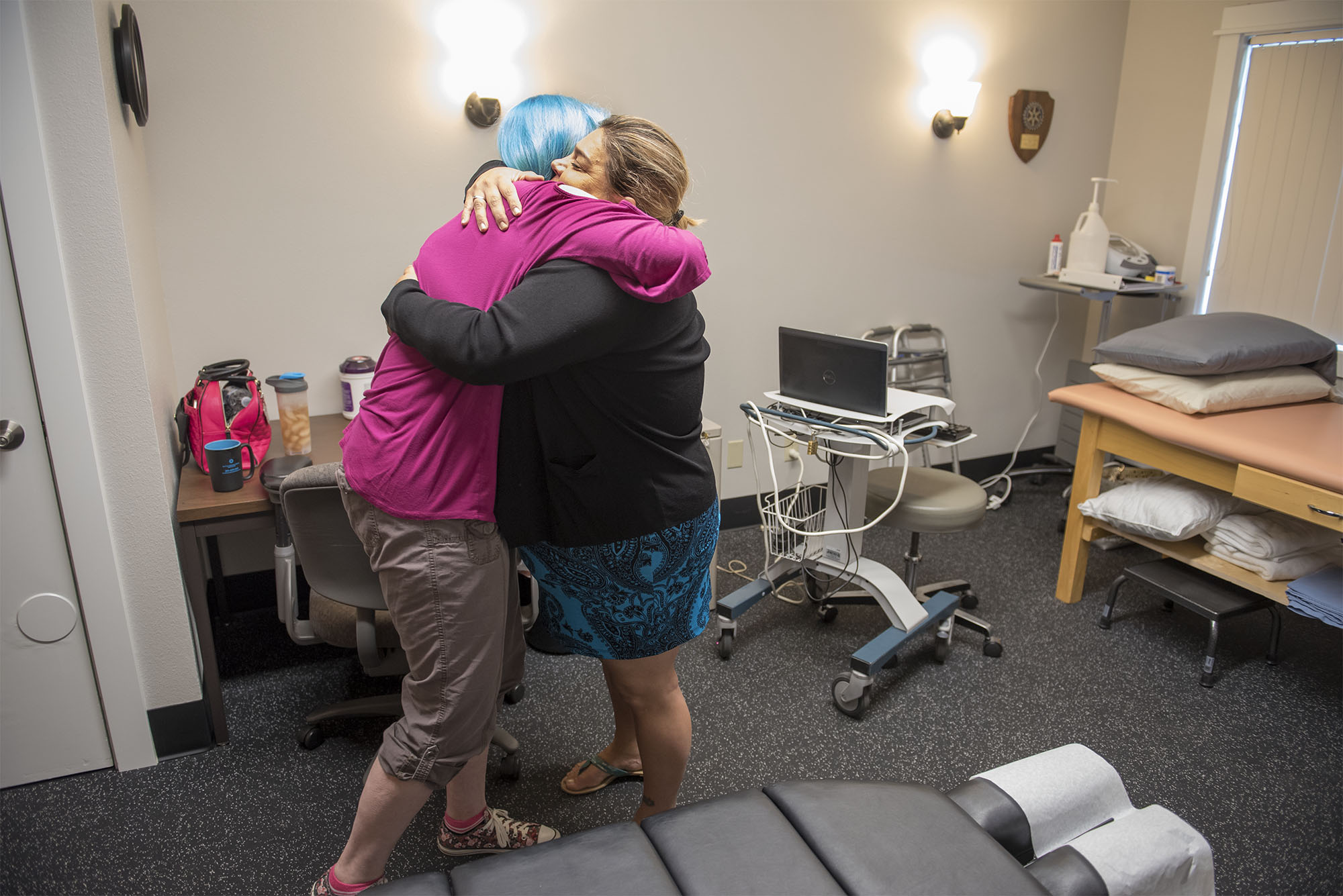  Timberly Eyssen hugs Chiropractic Physician Gloria Arroyo-Grubbs during a chiropractic visit at Battleground Health Care after Eyssen remarks that her neck has improved since their last visit, on Wednesday, Aug. 25, 2018. 