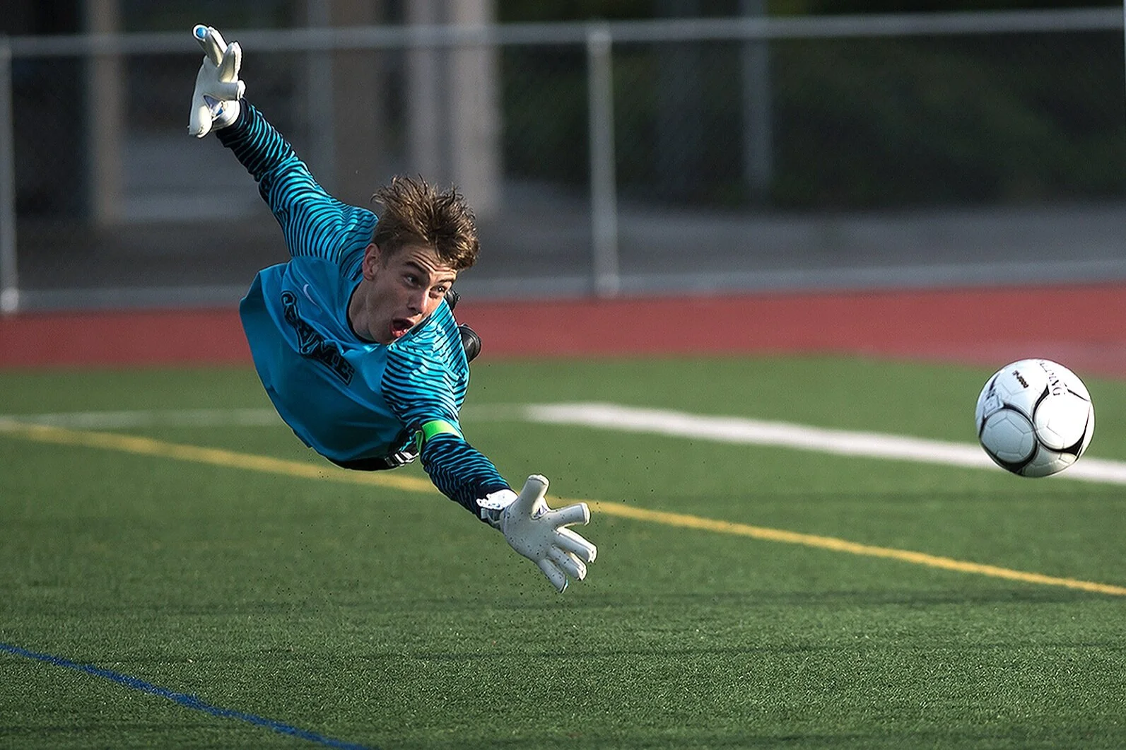 Sehome Goalkeeper Mason Kealy dives for and misses a shot on goal by Columbia River that would bounce off the goalpost during the WIAA 2A Championship title game at Sumner High School on Saturday, May 25, 2019 