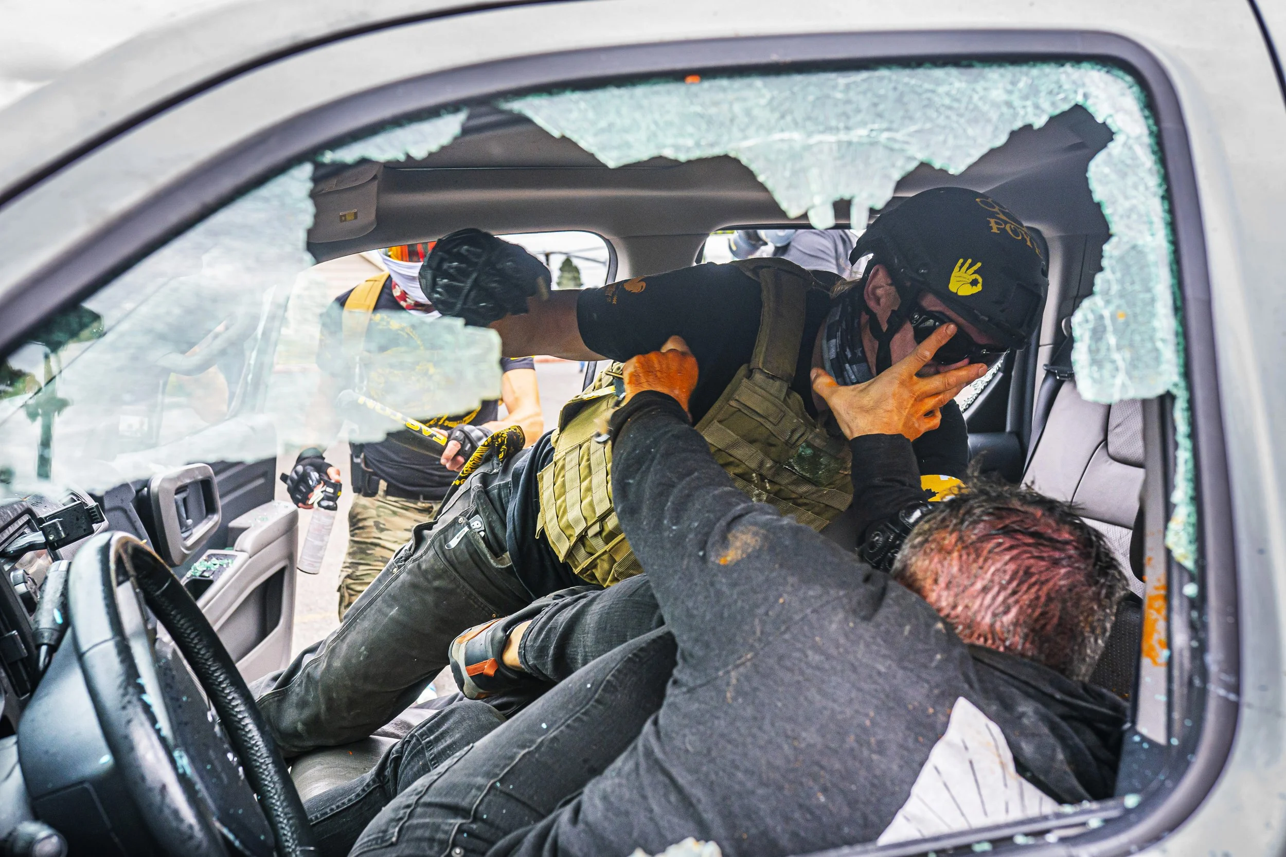  Proud Boy Miles Furrow beats an anti-fascist counter protester during violent clashes at the site of an annual Proud Boy event on Aug. 22, 2021 in Portland, Oregon. 