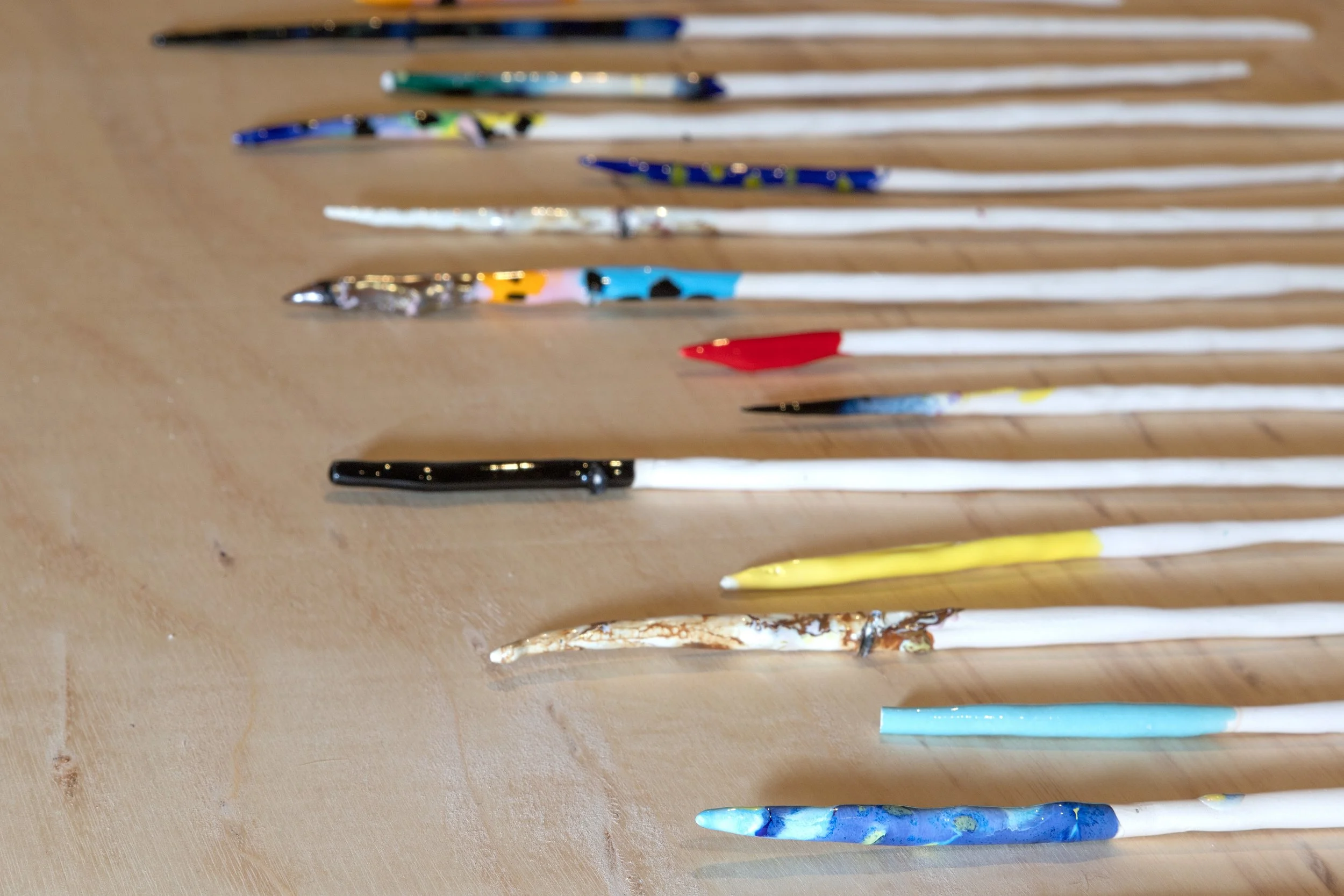 'Wands', Hand rolled porcelain dipped in glaze, 30-40cm length (approx.) Installation shot, solo show Mermaid Arts Centre, Bray, Ireland, 2019