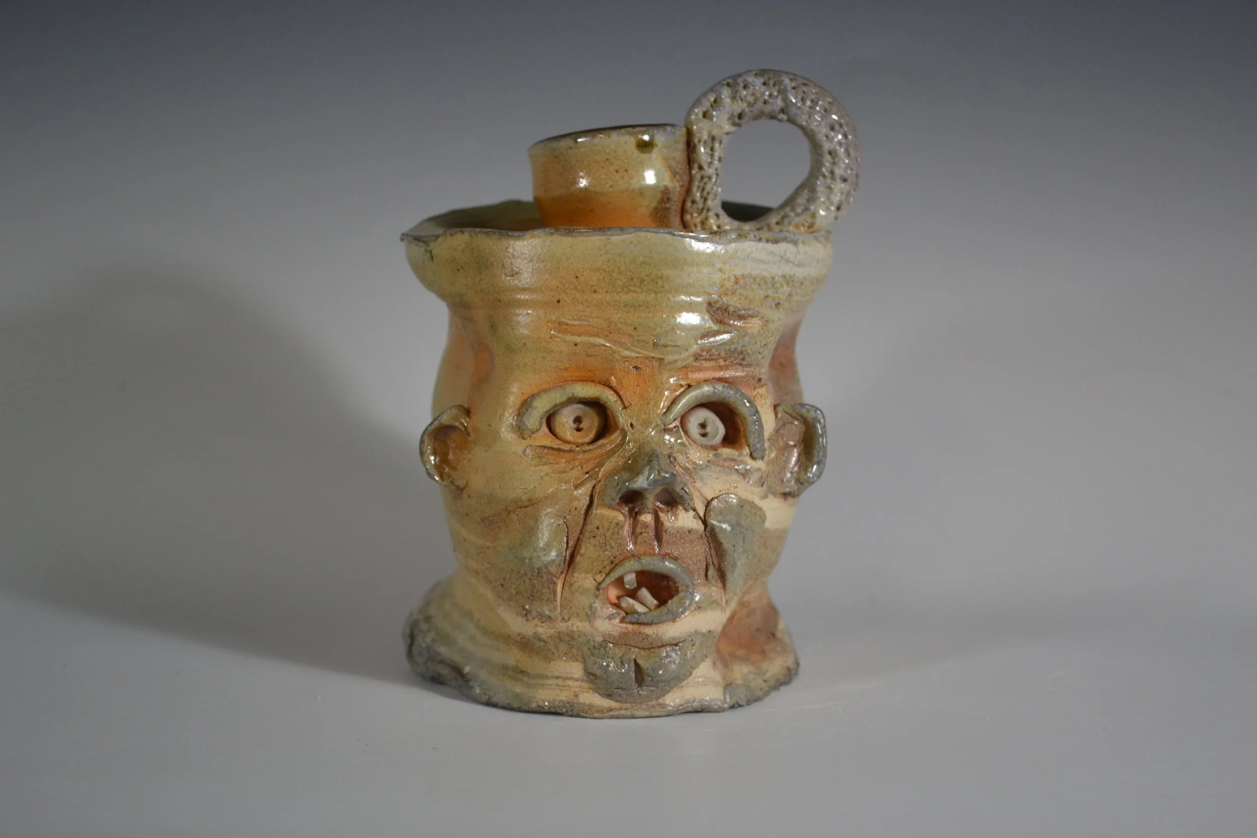  Indy Face Jugs was a collaborative effort involving over 40 Indianapolis artists from all mediums. Artists were invited to add a face to thrown jug. The over 200 jugs were shown at the Do317 Gallery September 7th 2018. 