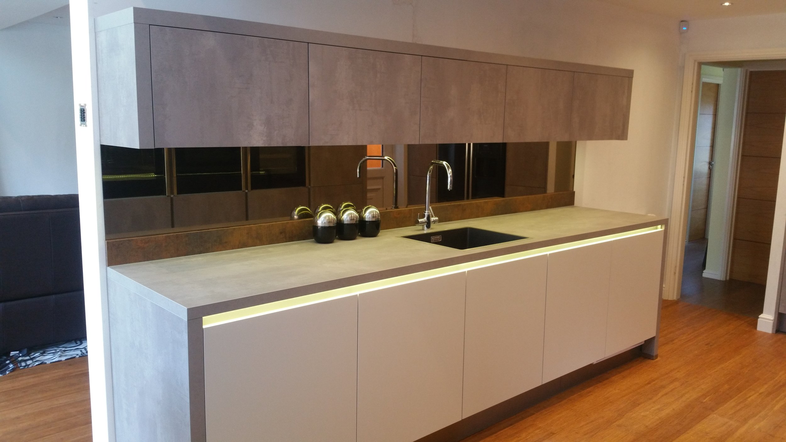This is an amazing kitchen. The client and our very own designer, Jill, can take great pride in the thought that went into all this. The copper upstand draws the whole room together, and the bronzed mirror sits reflects the space beautifully.