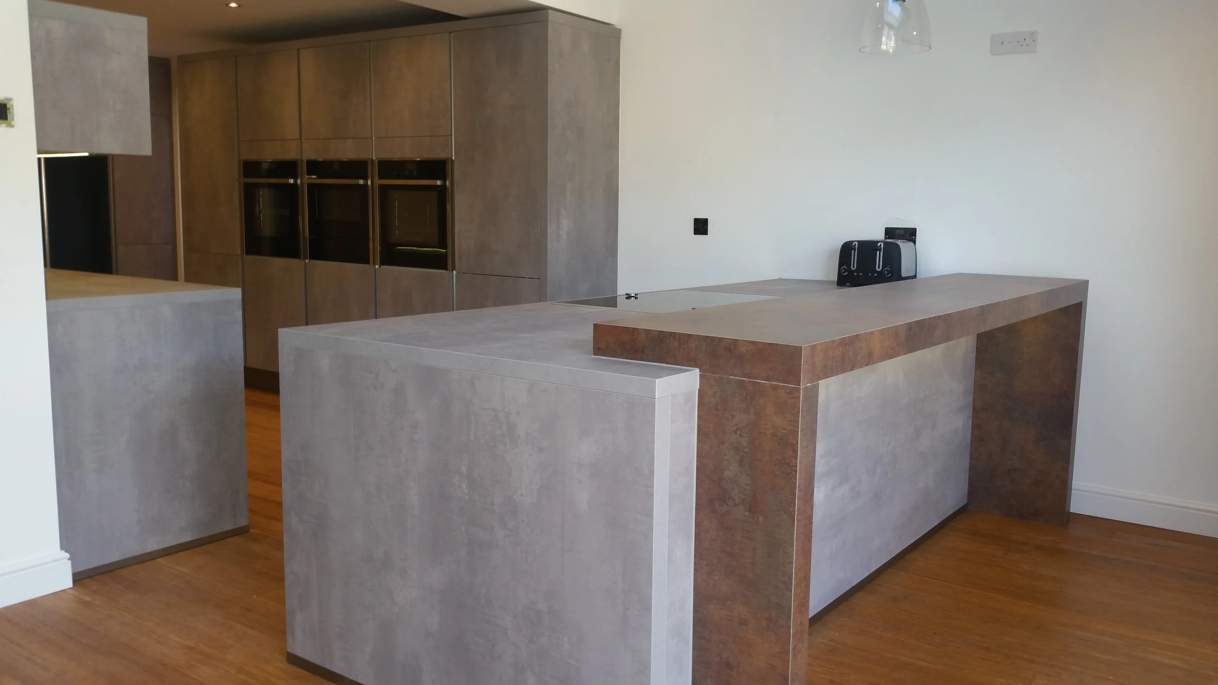 One of the great benefits of laminate is that the fitter can install on the day the kitchen goes in. No need to wait for template and fabrication off site. What's more, our friends in Germany cut and edge the laminates exactly, so that on-site cutti…