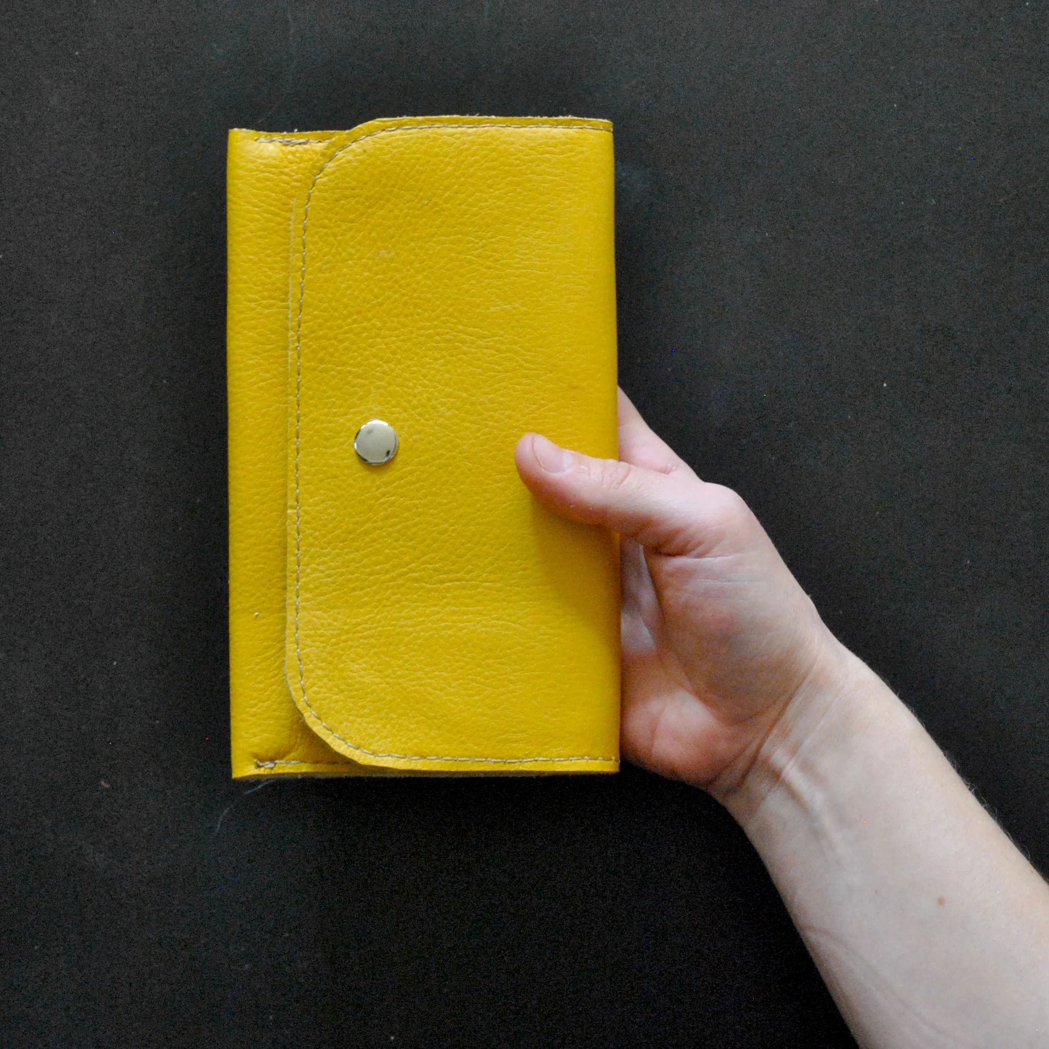billfold_yellow_hand_sq.jpg