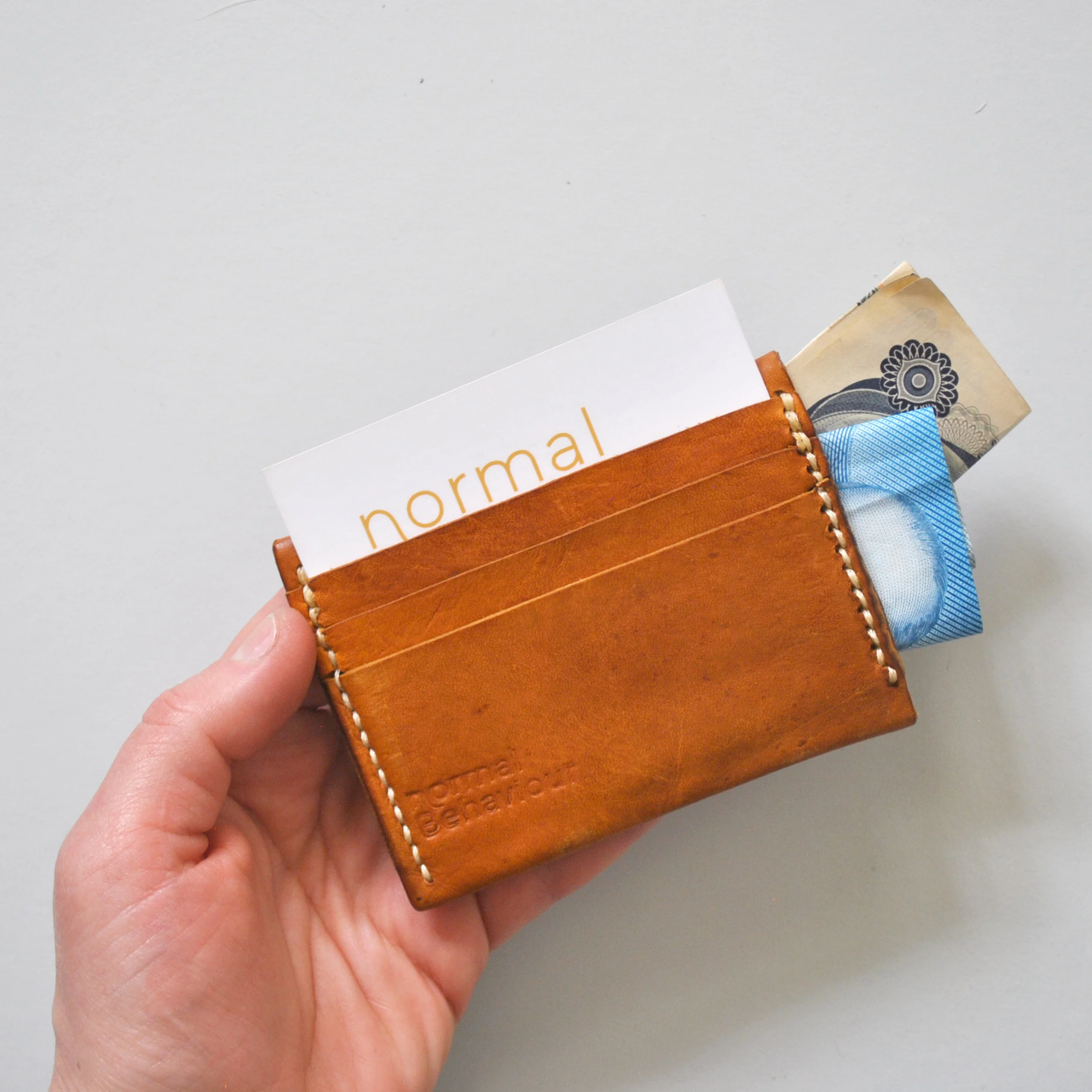 miniwallet_tan_hand_sq.jpg
