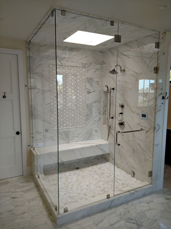 A Starphire (ultra-clear) Low Iron glass steam shower with operable transom, Cheviot Hills (Beverly Hills) CA. 