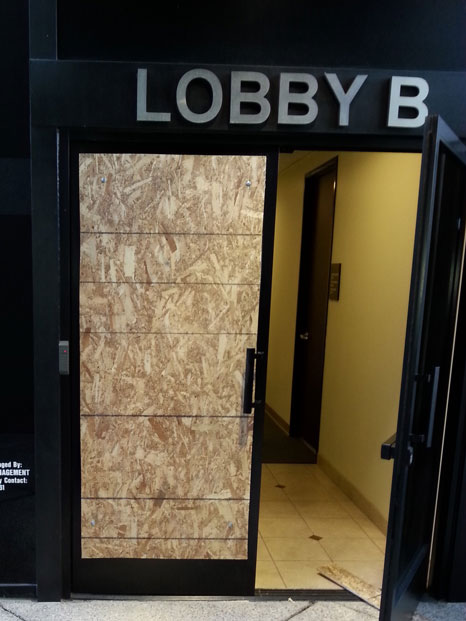 Commercial Storefront Door with temporary Emergency Board-up.