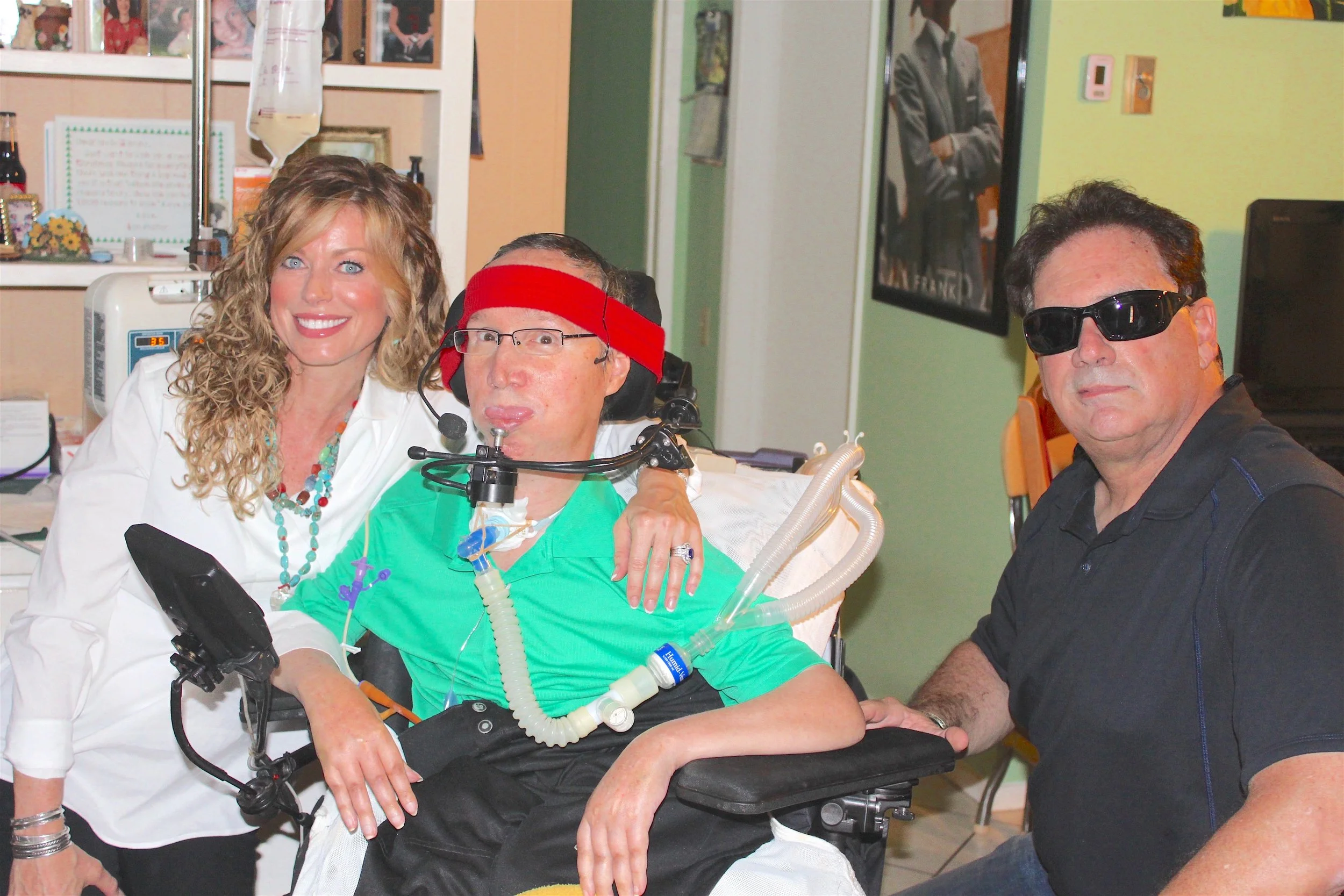 LAGUNA WOODS VILLAGE, Left to Right: Keira Dux, John Lombardo Jr. (sheer joy visible in his eyes), and namesake of the main character in the movie Bloodsport, Frank Dux during a requested private appearance in the Lombardo manor.