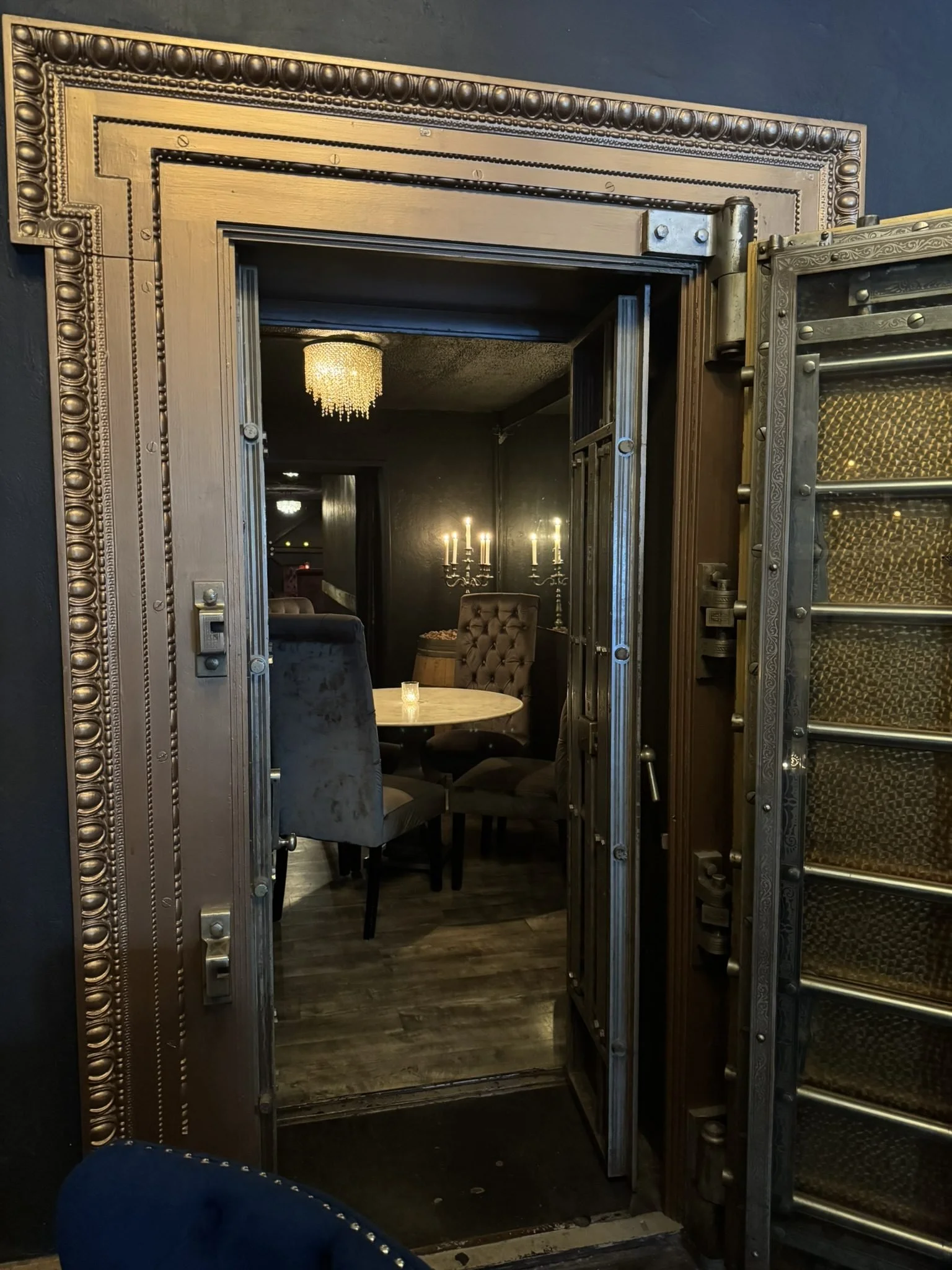 The original bank vault door at The Saint, St. Helena — the way down to the Cellar Speakeasy