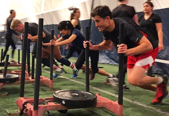  RUSH This class will test your max-effort by challenging you with short, explosive intervals with quick rest periods. Expect your entire body to be tested with compound movements, sprints, agility ladders, sleds & more! Participants can expect to develop strength, cardio and power. Bring on the sweat!