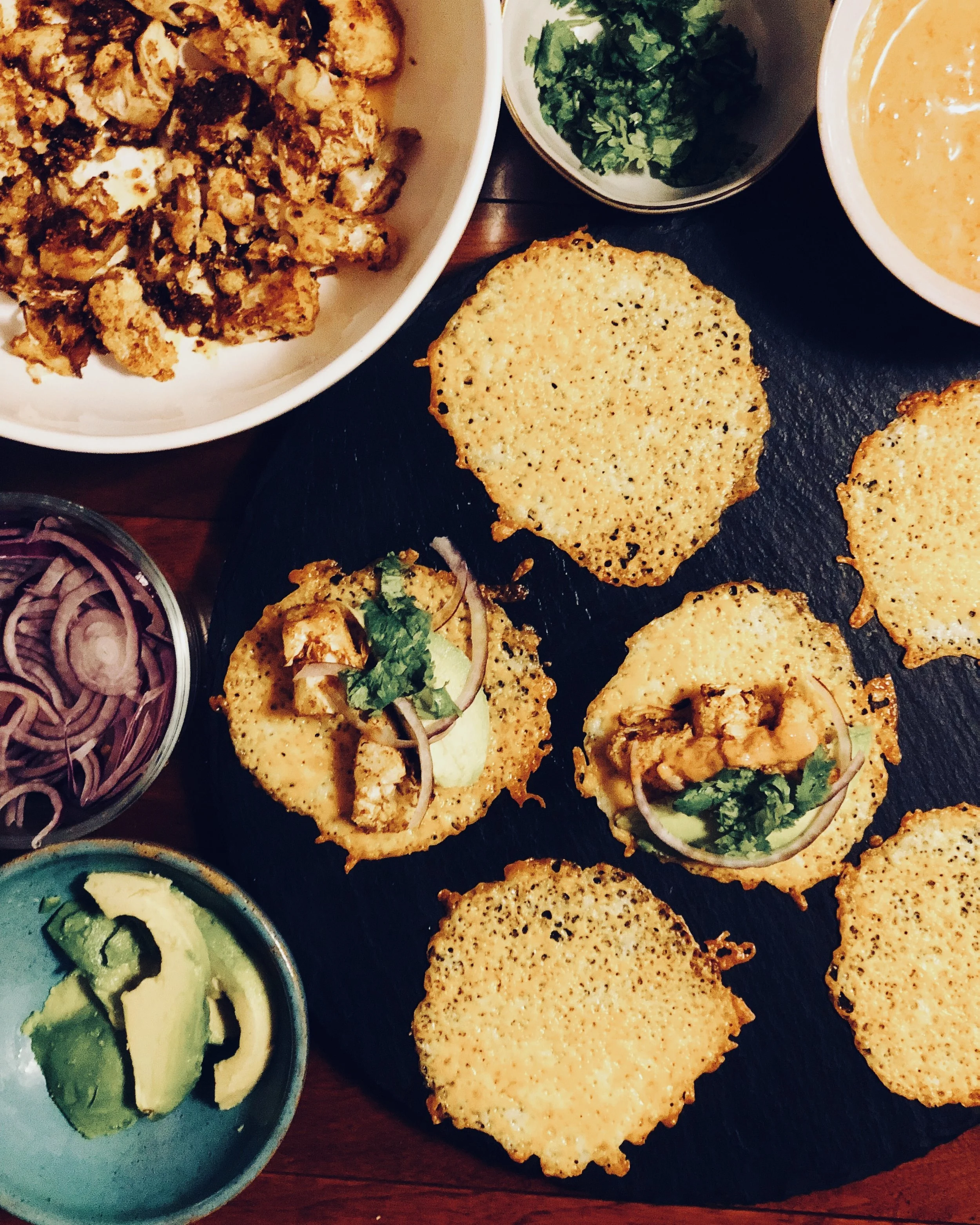 Cheese shell tacos with roasted cauliflower and chipotle crema