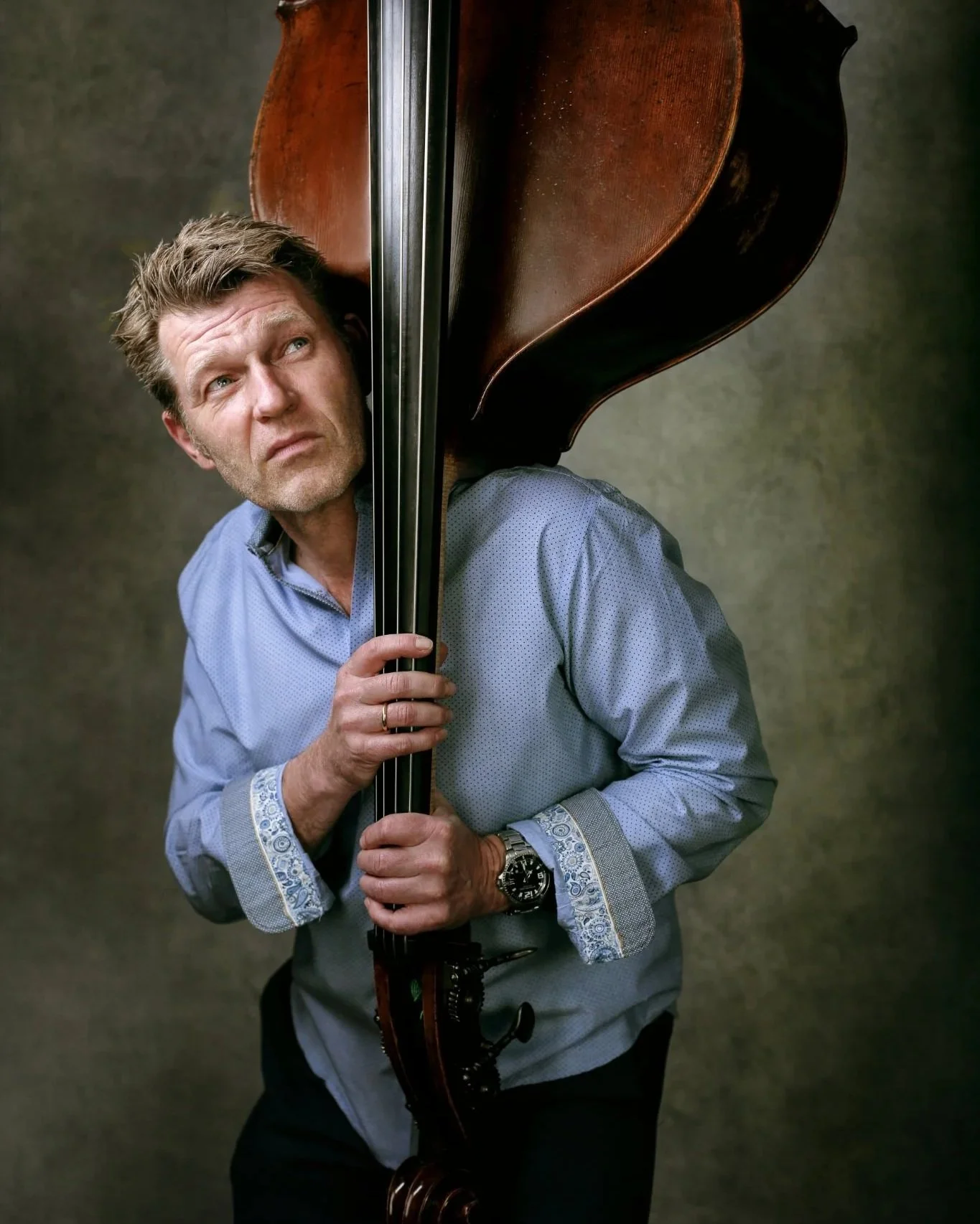Portrait of musician Martin Wind with his instrument, Garden City NY