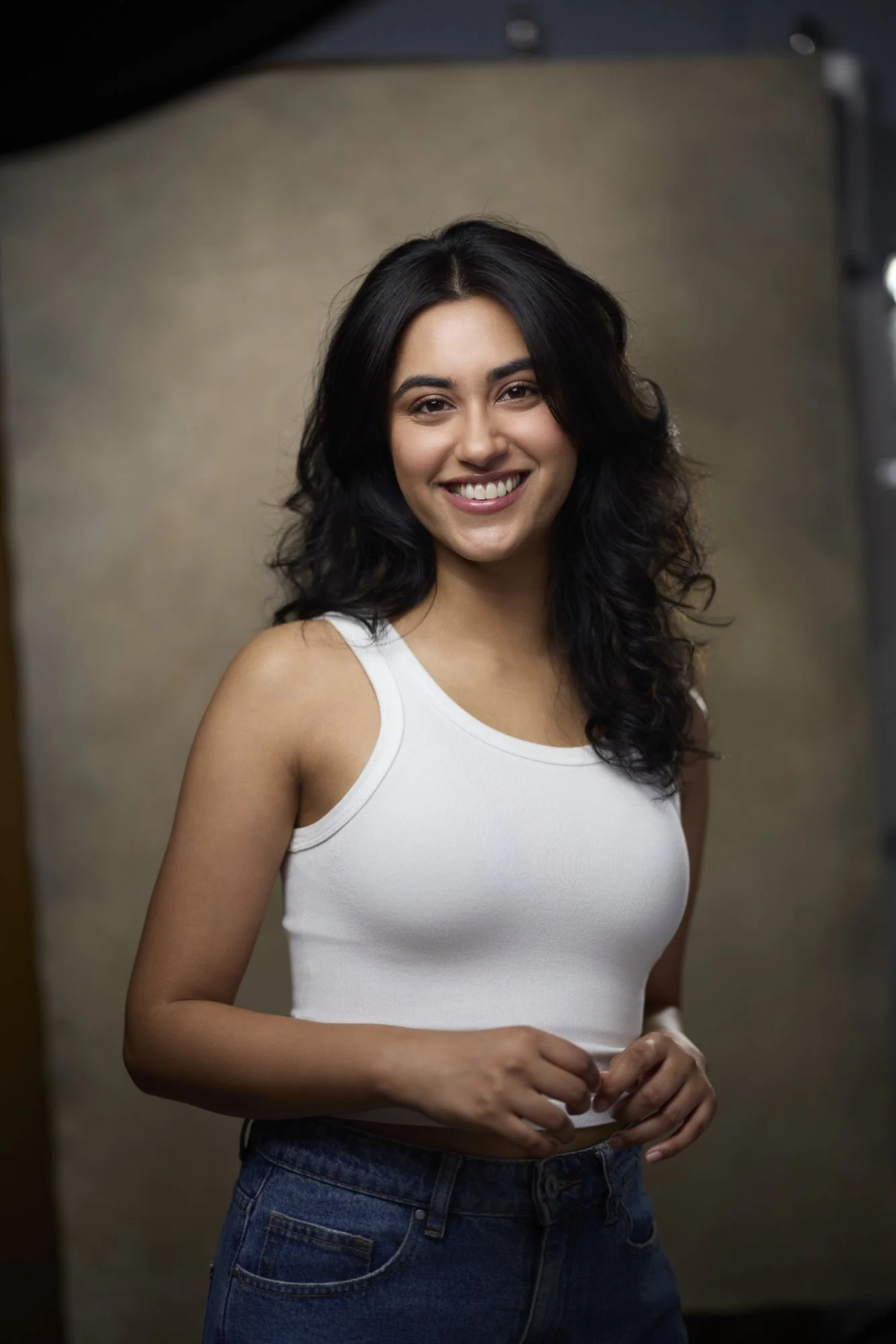 Acting headshot example - female actor in white tank top smiling