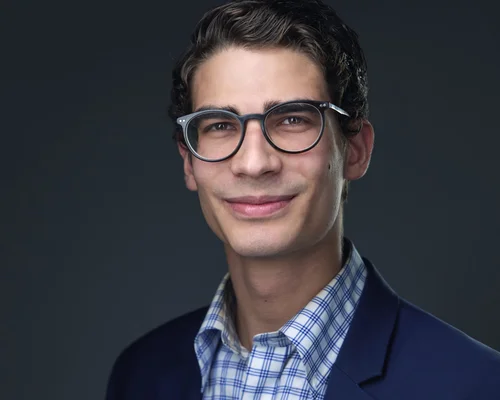 Headshot subject wearing glasses