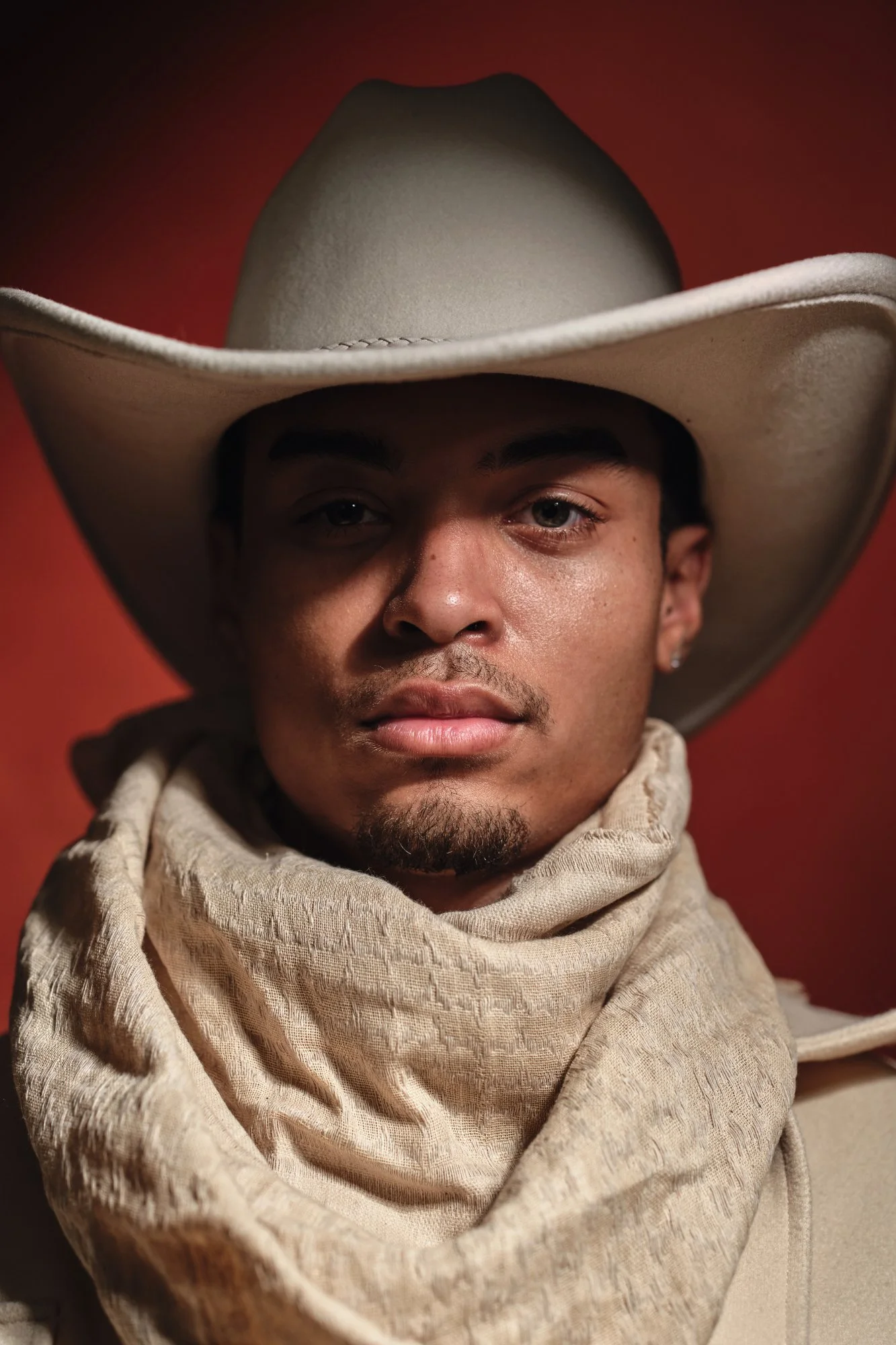 Actor headshot showing accessories - actor in cowboy hat and scarf