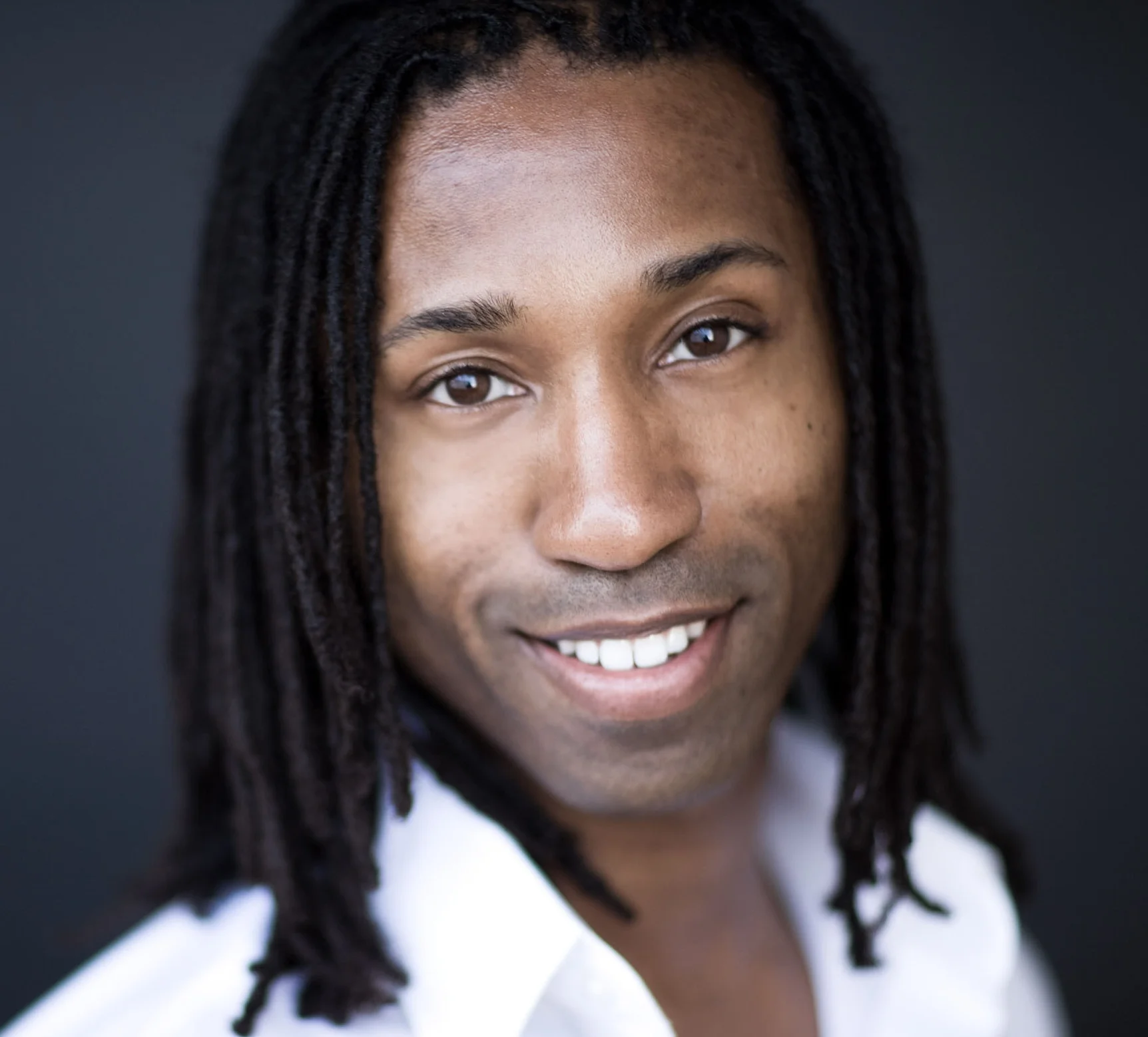 Omari_Tau_Headshot_C_2008.jpg.jpeg