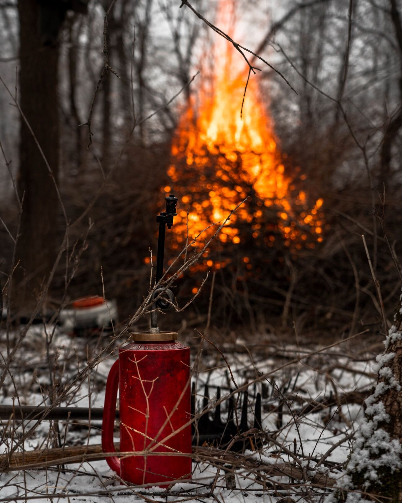 drip torch and burning brush pile