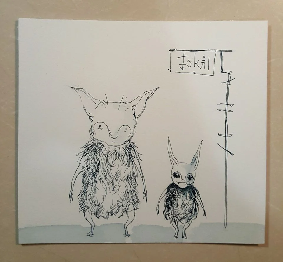 Two monsters patiently waiting for a bus