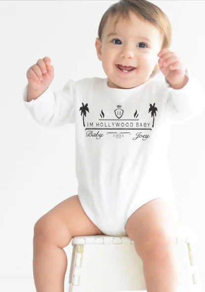 baby in white onesie