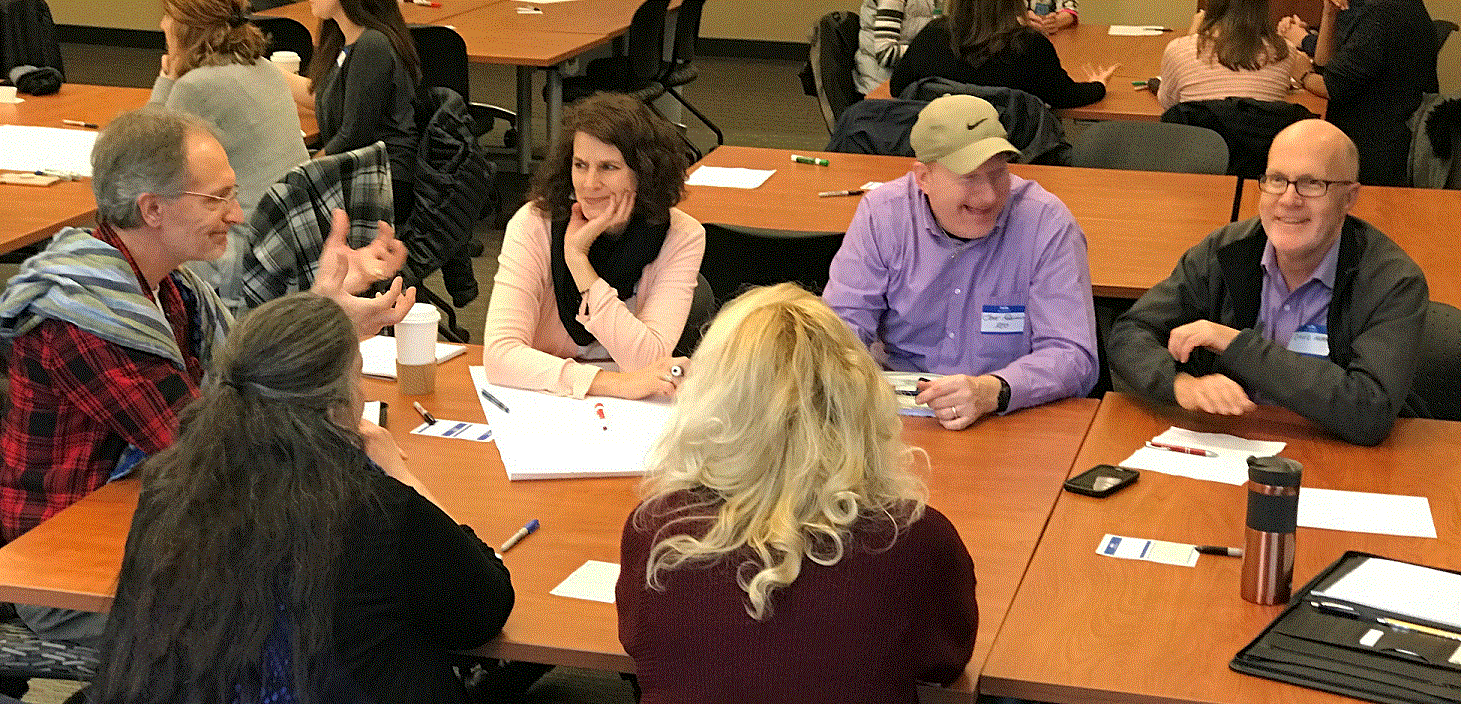 A Meet Up Table Group discusses human-centered work