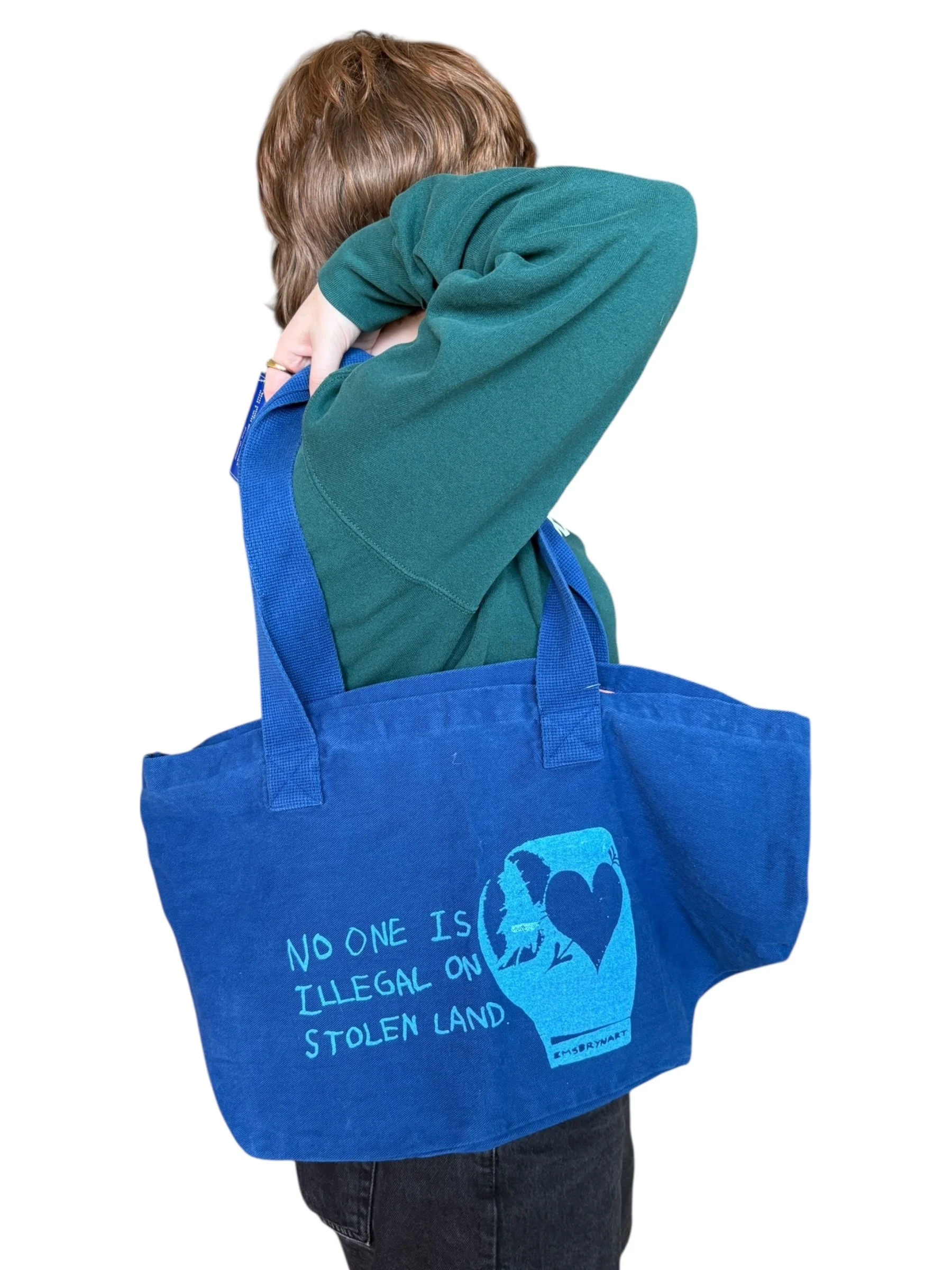 no one is illegal on stolen land tote bag