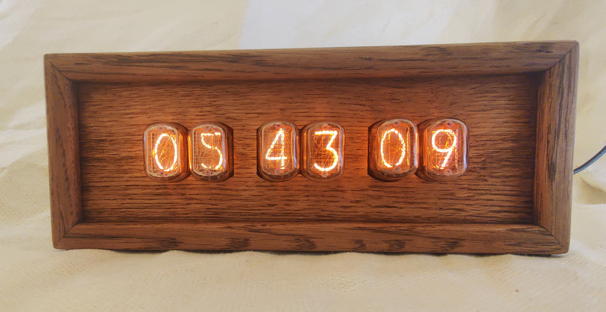 cristian dragomirescu oak stain nixie with plug.png