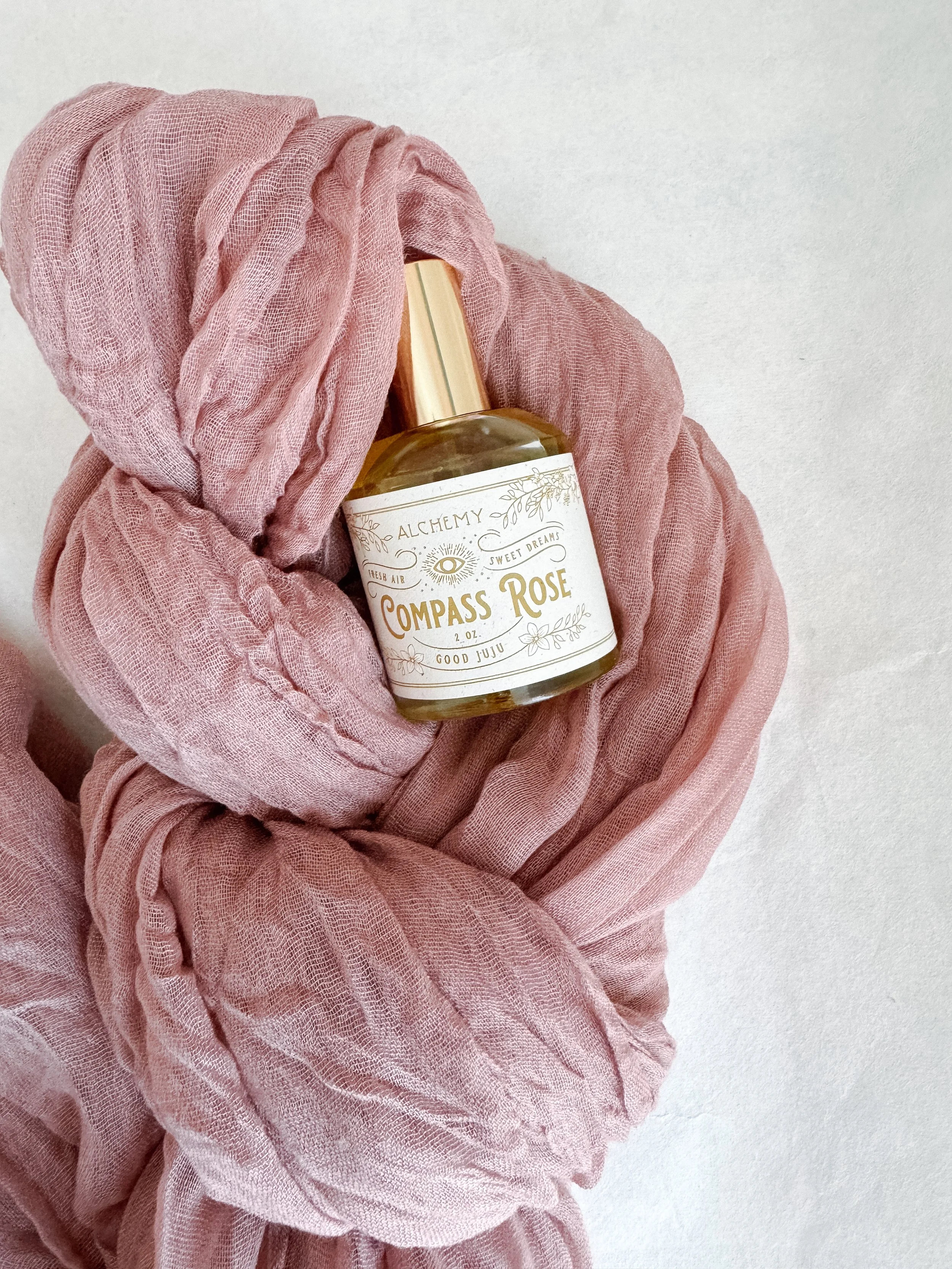 compass rose flat lay with scarf in knots.JPG