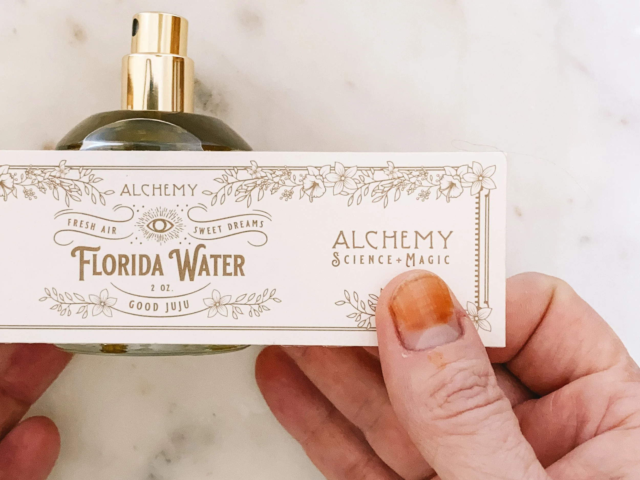 labeling florida water by hand.JPG
